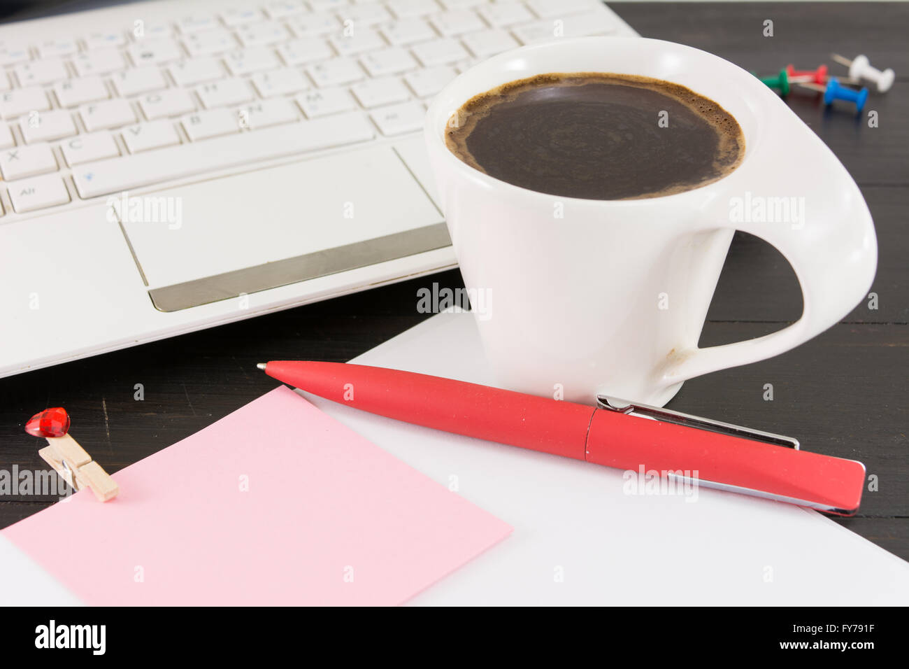 Cup of coffe for a good working day. Coffee and tech accessories on black table Stock Photo
