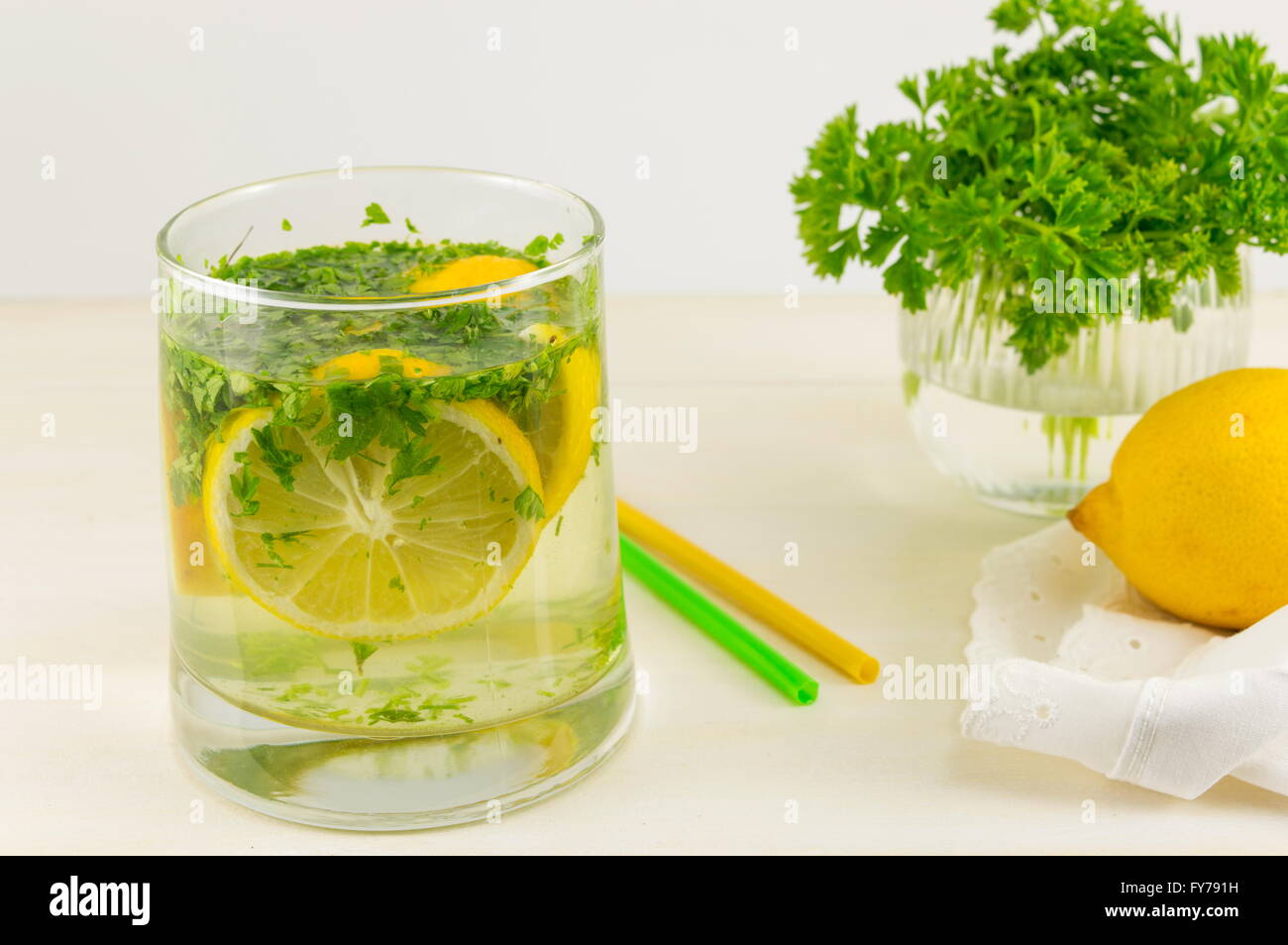 Water with parsley and lemon. Diet beverage Stock Photo