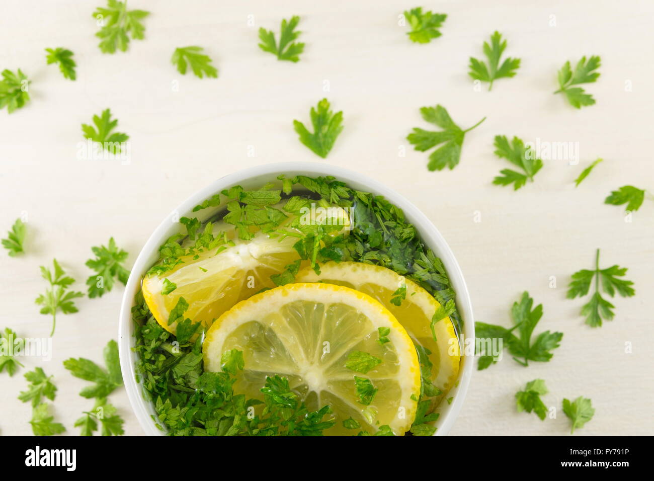 Water with parsley and lemon. Diet beverage Stock Photo