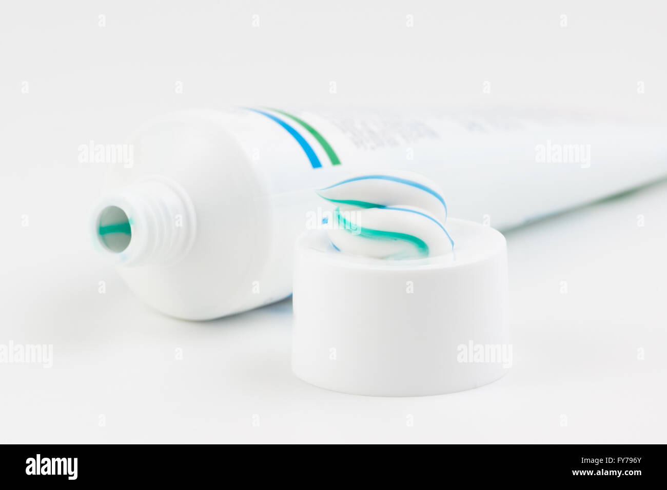 toothpaste tube with a small amount of toothpaste on the cap Stock Photo