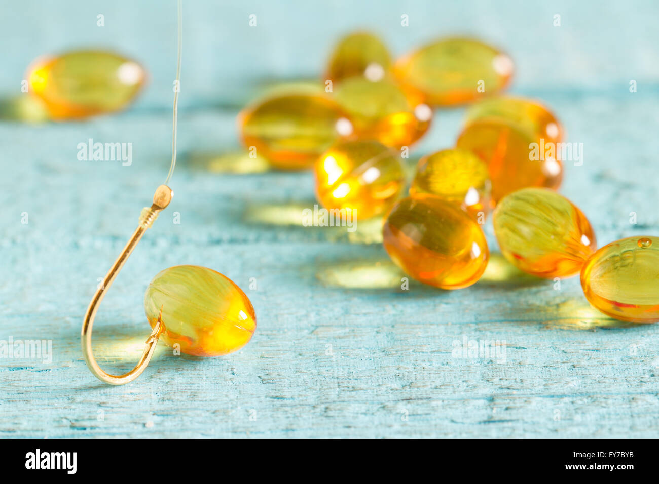 Omega 3 pill on fishing hook Stock Photo Alamy