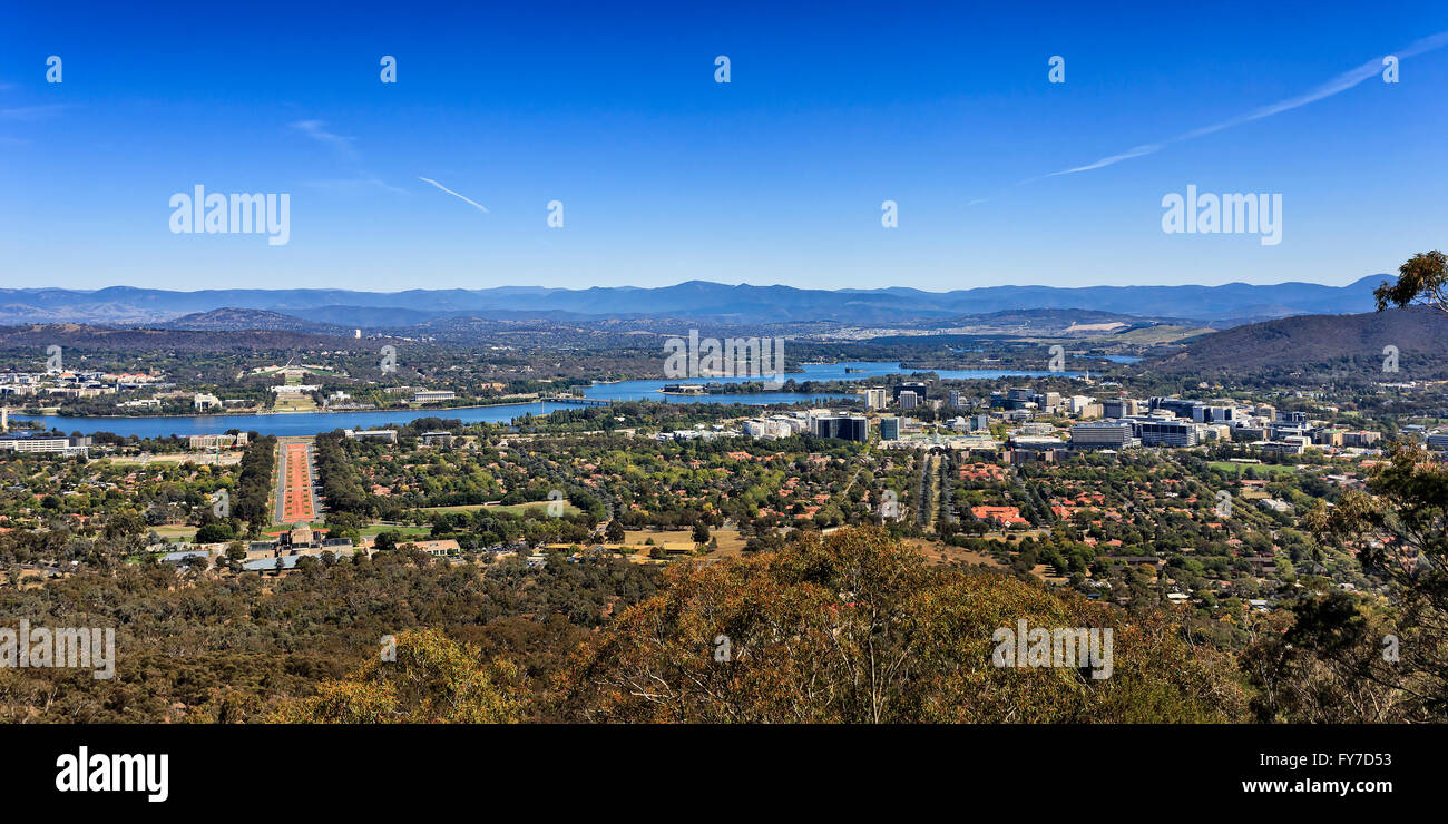 Panoramic view of Canberra city downtown and capital hill from Mt Ainslie on a sunny bright day when sky is deep and blue Stock Photo