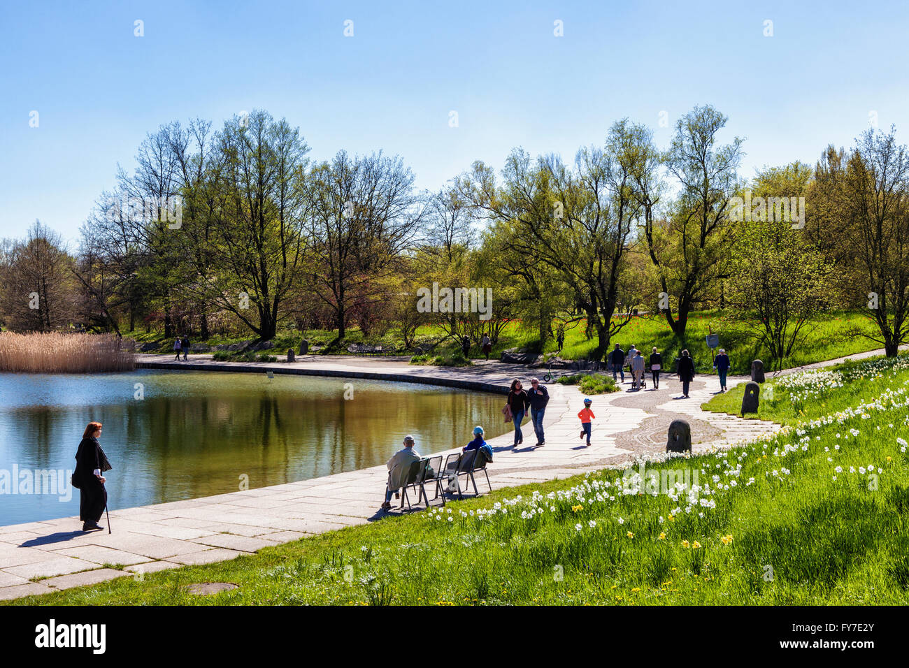 Britzer Garten, Neukölln, Berlin. People enjoy the Spring sunshine next