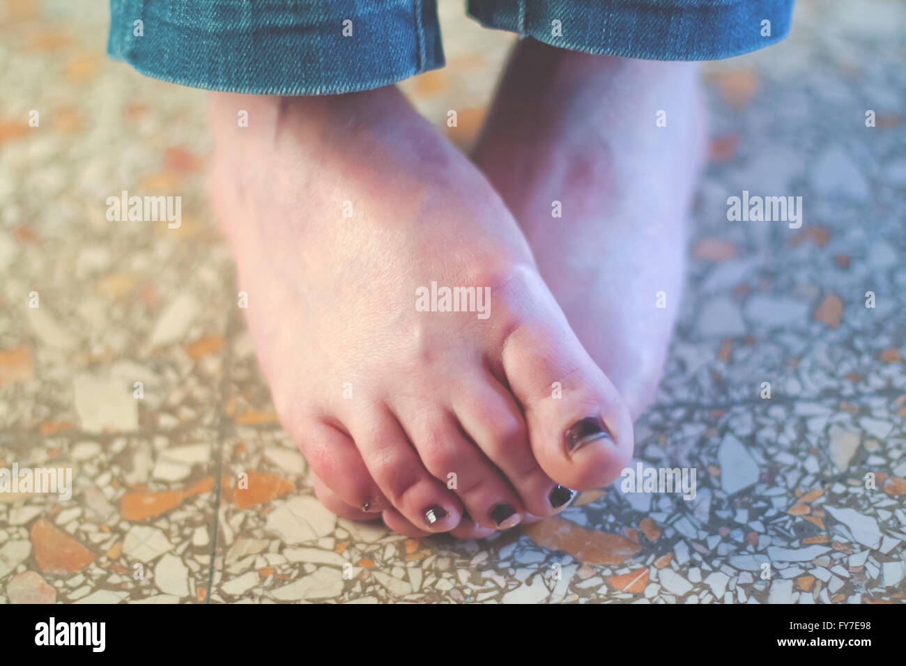 Female feet on the floor Stock Photo - Alamy