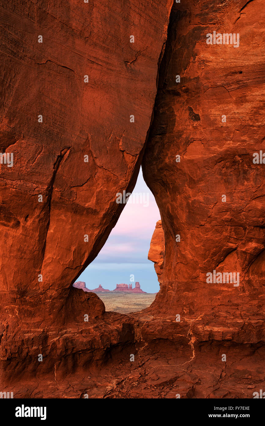 Sunset glow on Teardrop Arch in Utah’s Monument Valley Tribal Park. Stock Photo
