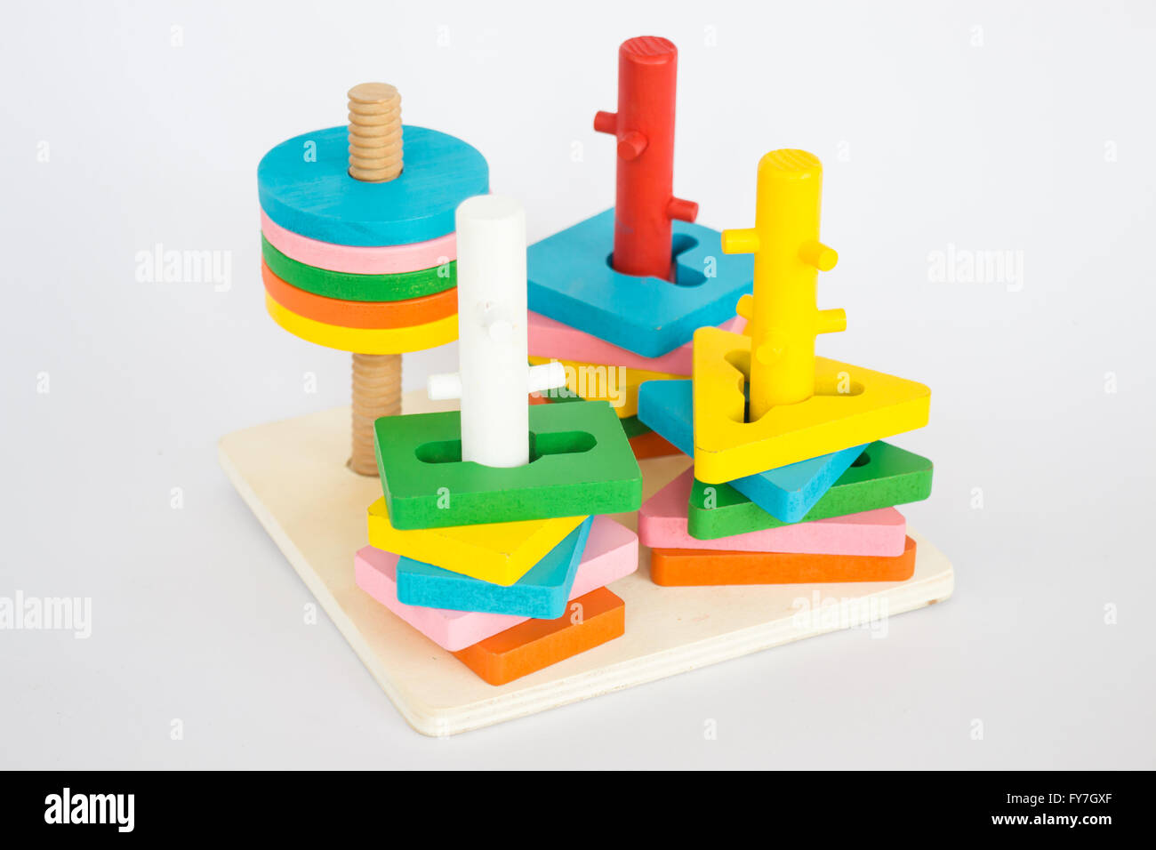 Colorful puzzle wooden toy on white table, stock photo Stock Photo - Alamy