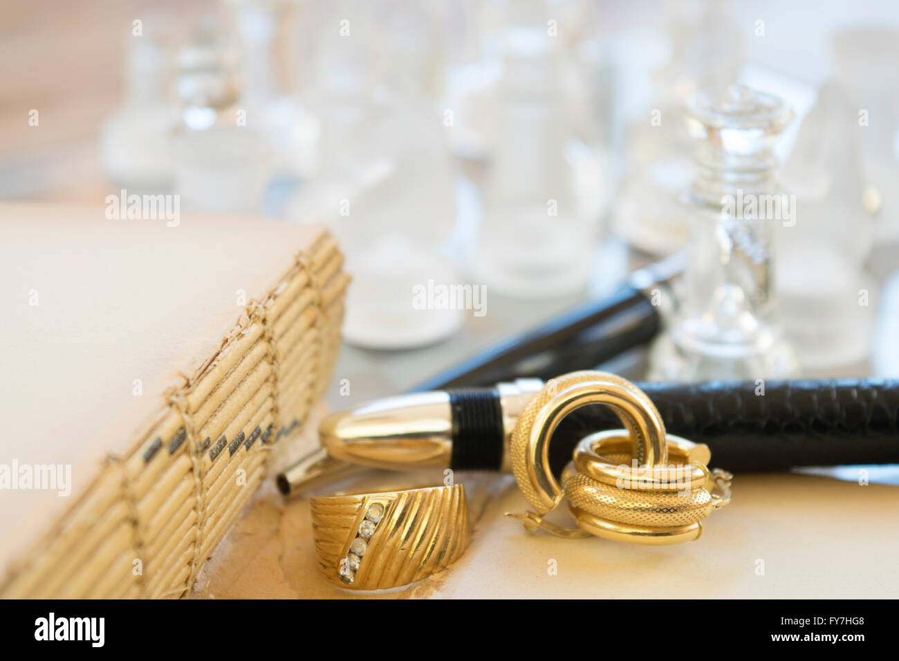 family jewels between  an ancient books and modern pens Stock Photo