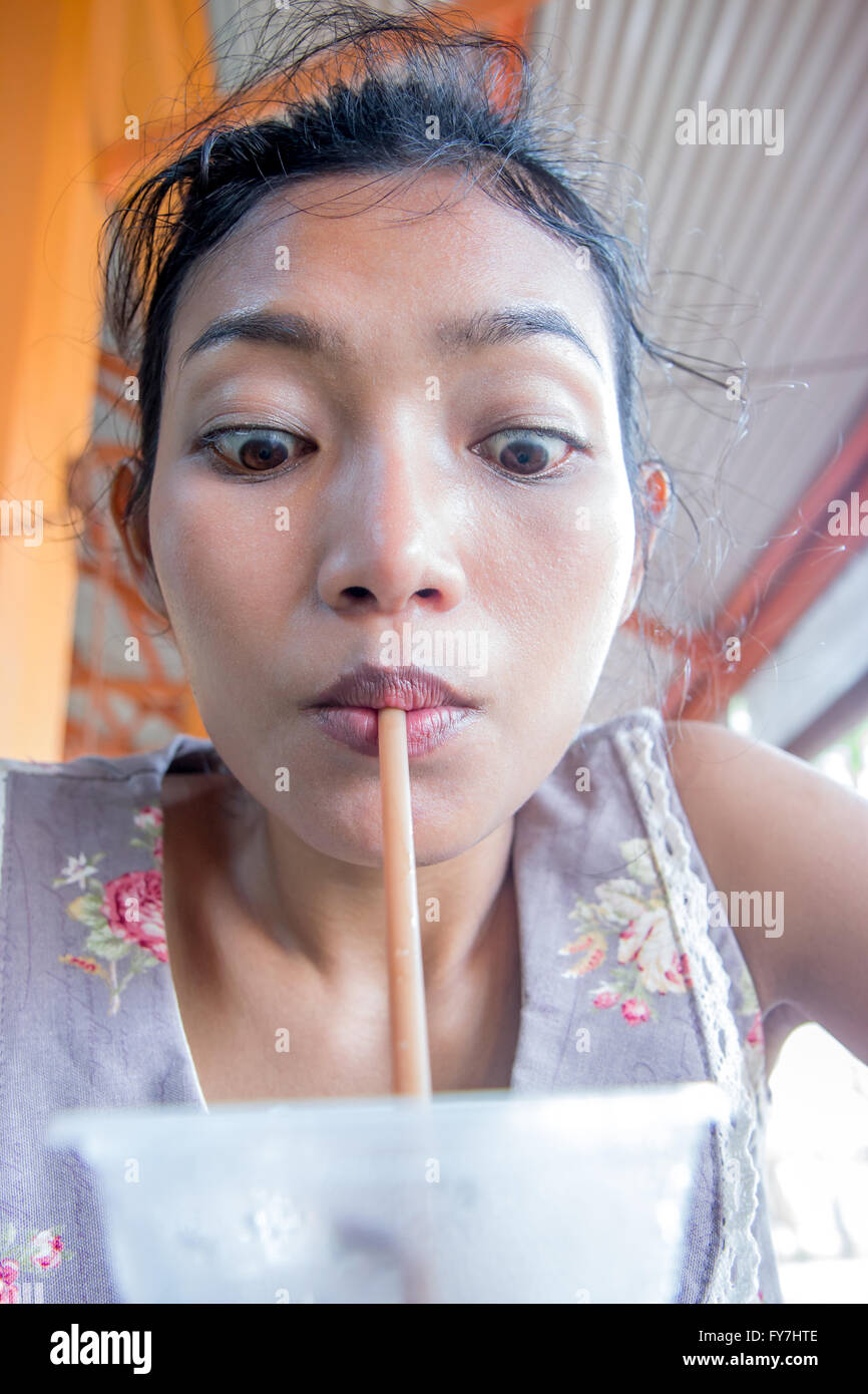 funny face girl drinks coffee Stock Photo