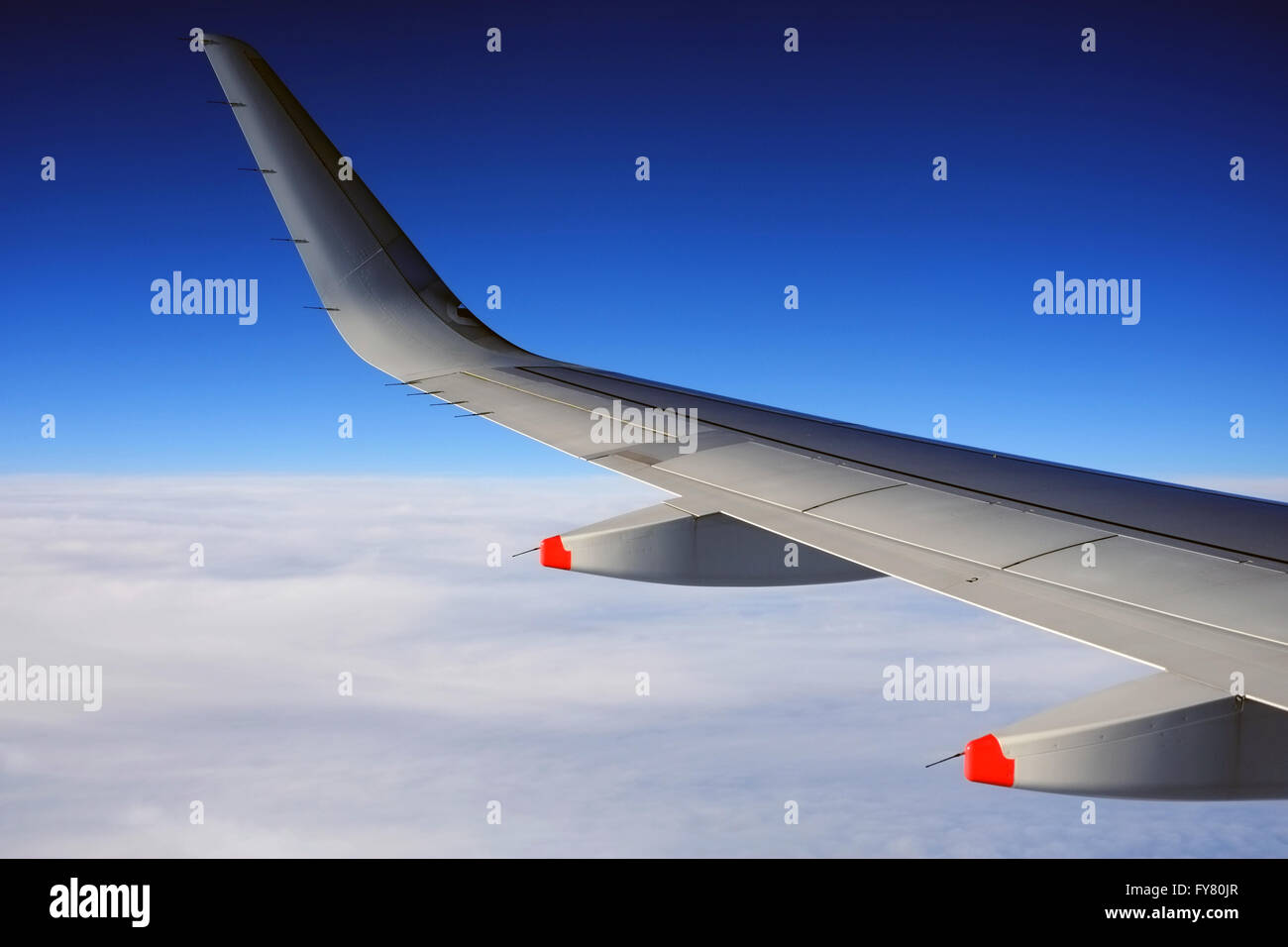 Wing of a British Airways Airbus A319 airplane in flight. Stock Photo