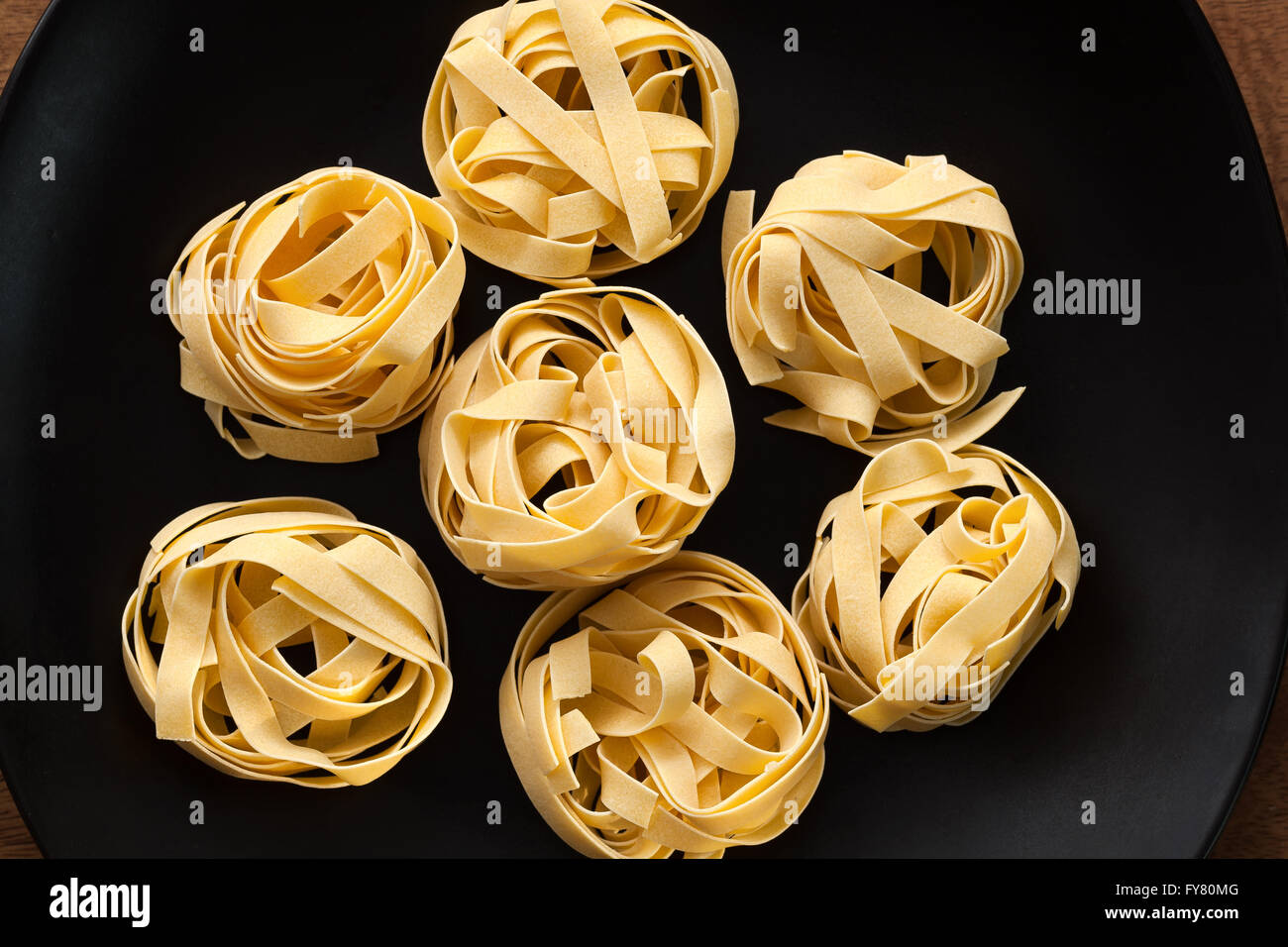 fettuccine pasta italian food still life rustic flat lay black