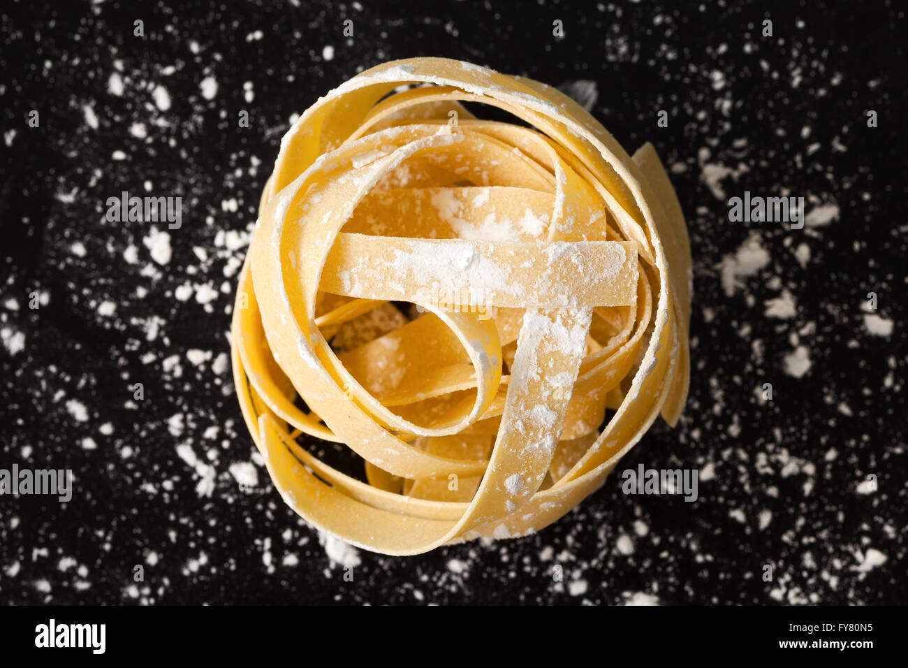 fettuccine pasta italian food still life rustic flat lay black