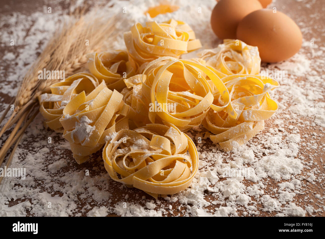 fettuccine pasta italian food still life rustic wood background