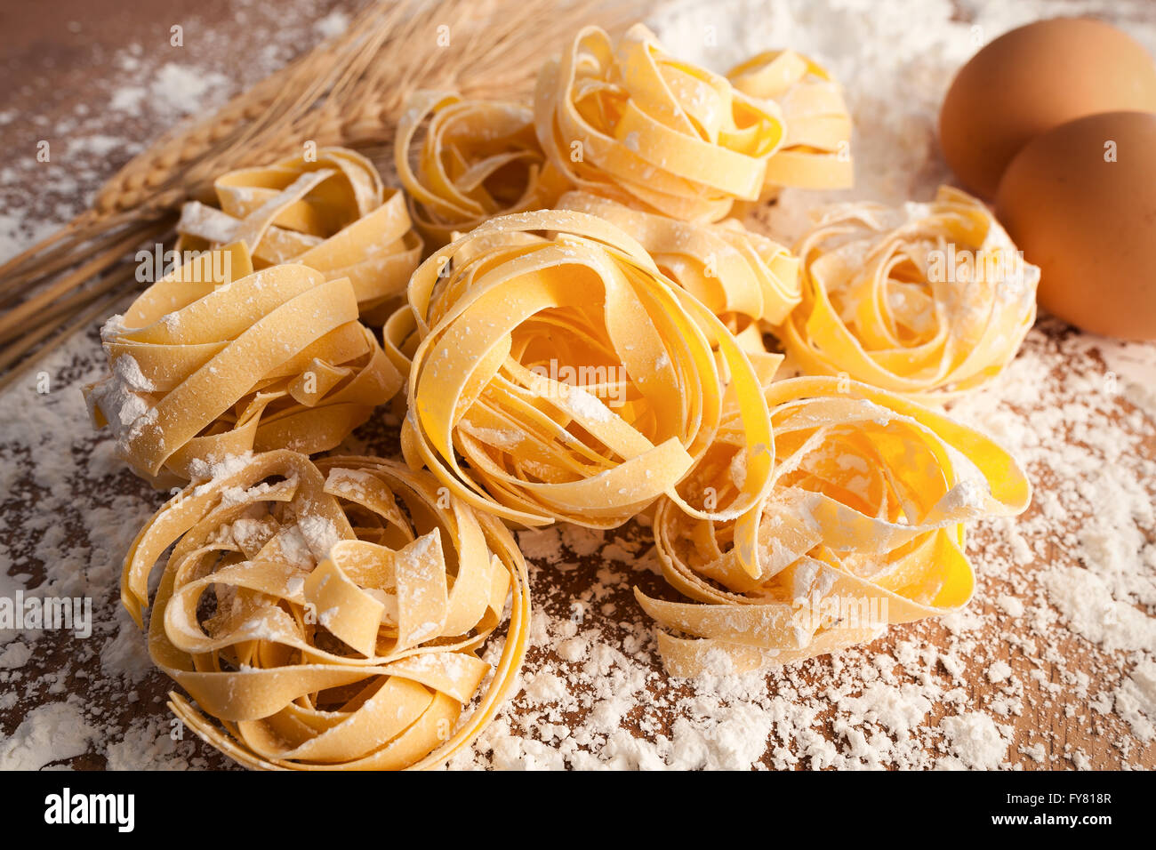 fettuccine pasta italian food still life rustic wood background