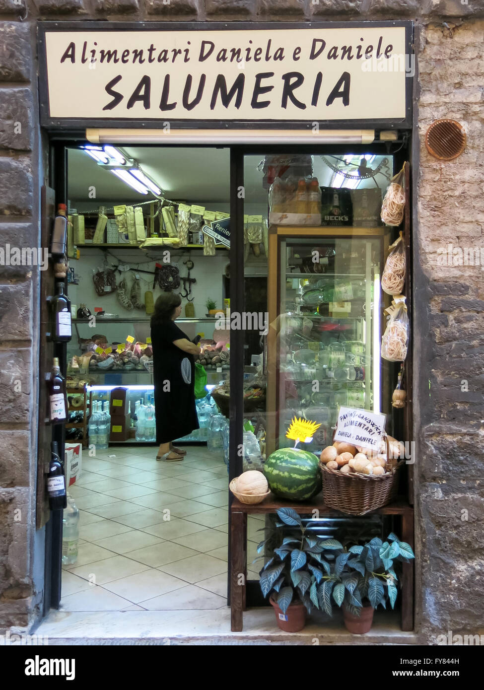 Typical Tuscan grocery shop in narrow street Via Tito Sarrocchi, Siena, Tuscany, Italy Stock Photo