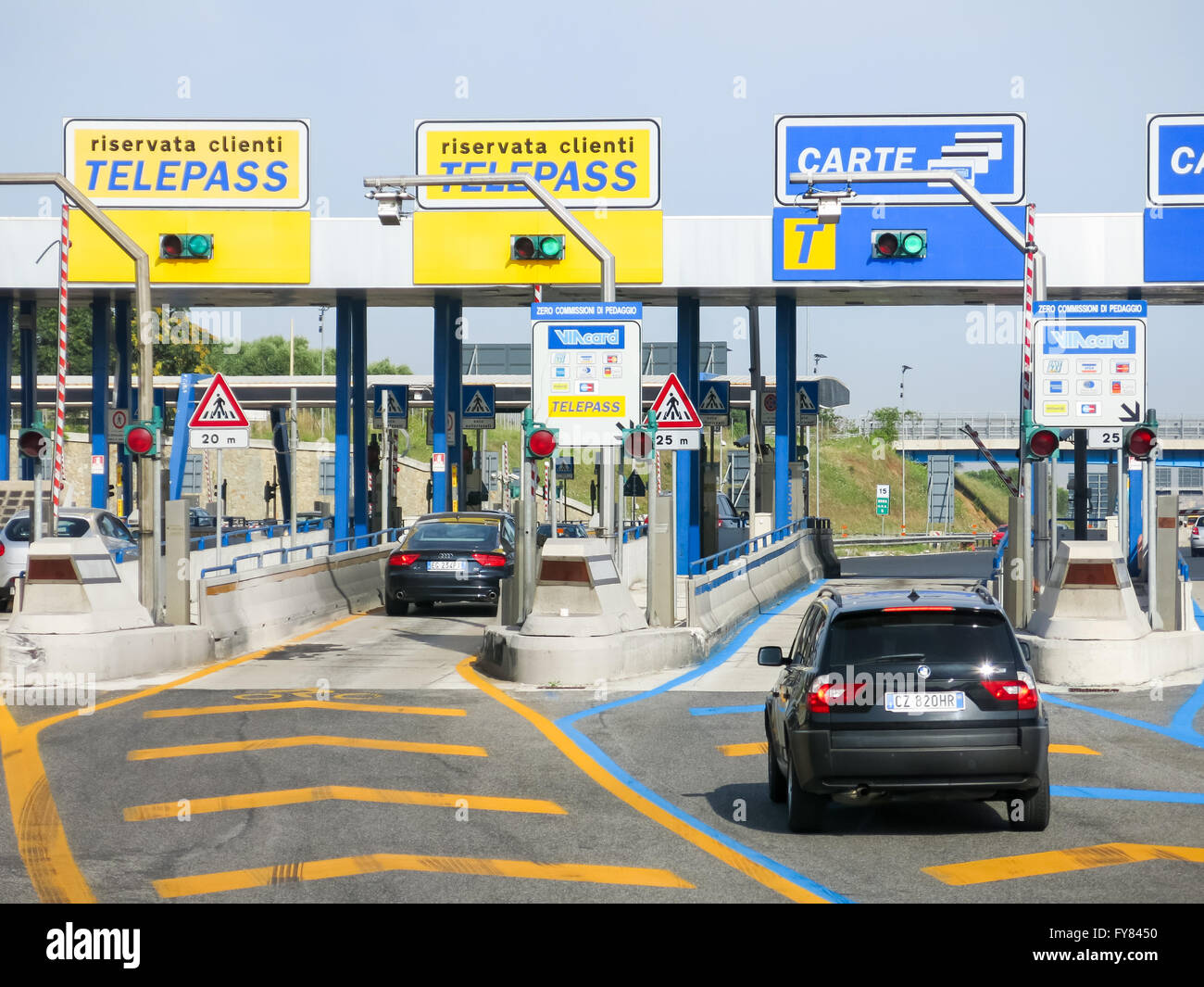 Cars at Autostrade (motorway, highway) Toll in Italy. Payment with Telepass or card. Stock Photo