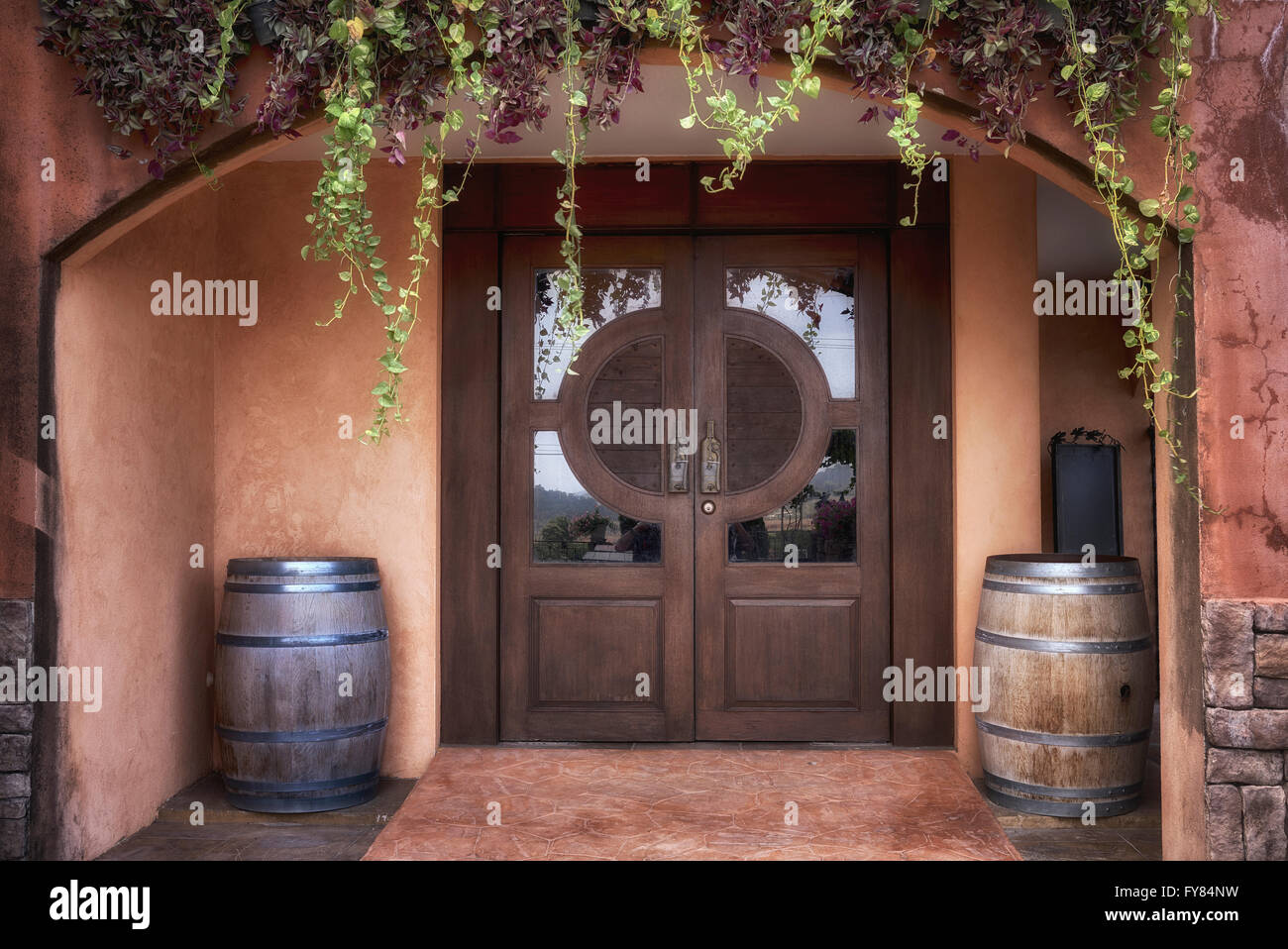Wine bar entrance door with promotional wooden barrels Stock Photo Alamy