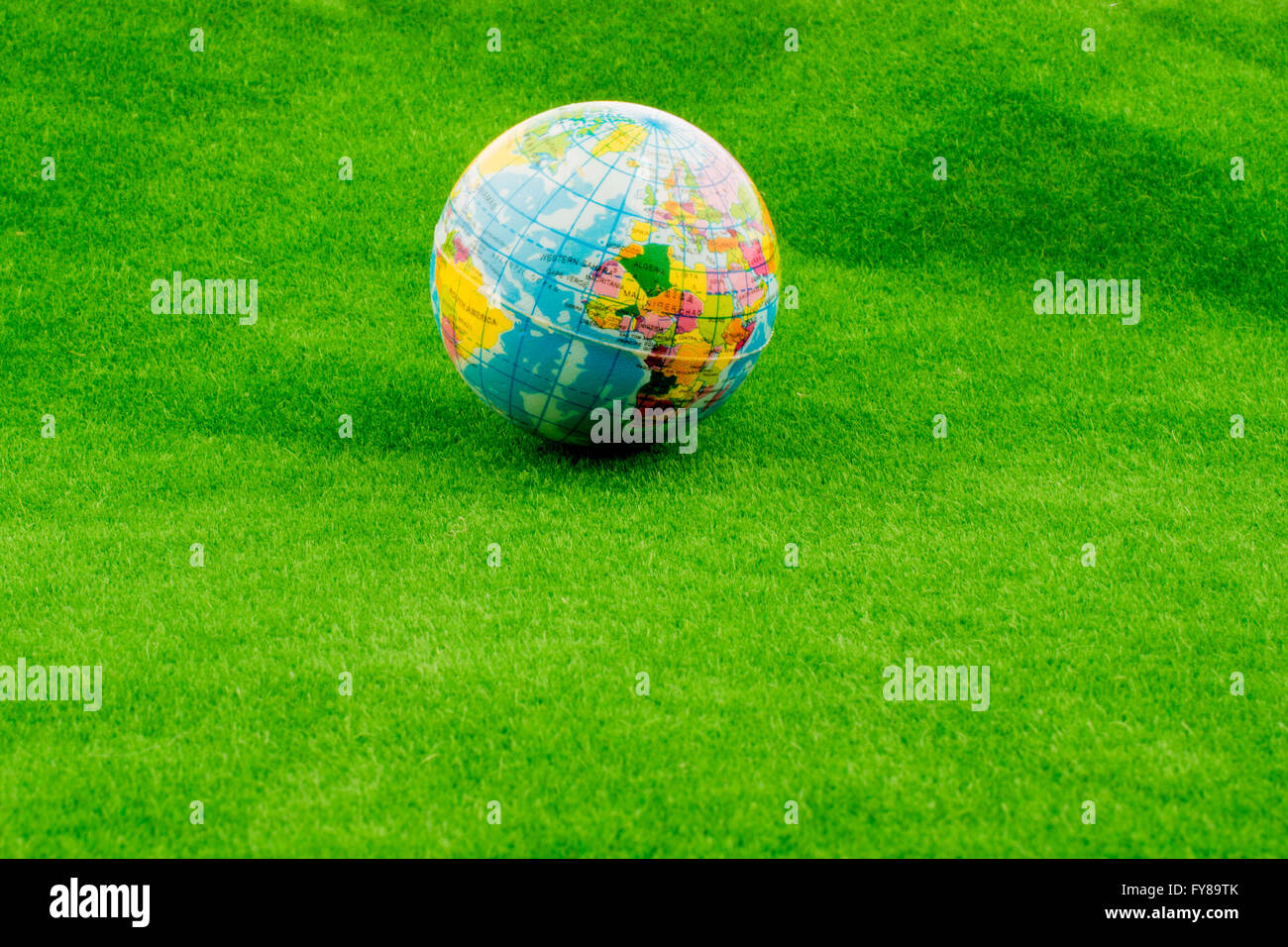World globe on green grass Stock Photo - Alamy