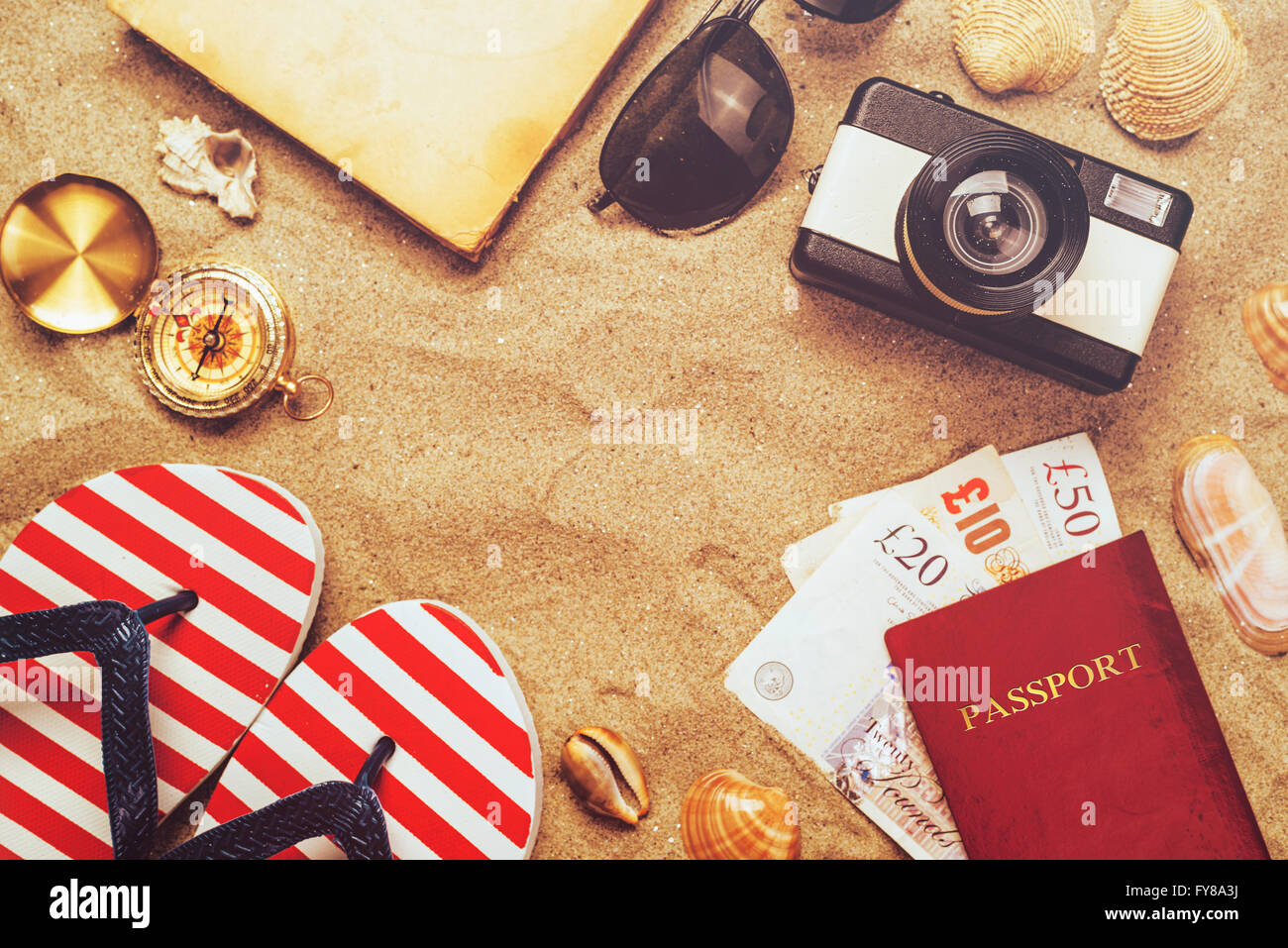 Summer vacation accessories on tropical sandy ocean beach, holidays abroad - summertime lifestyle objects Stock Photo