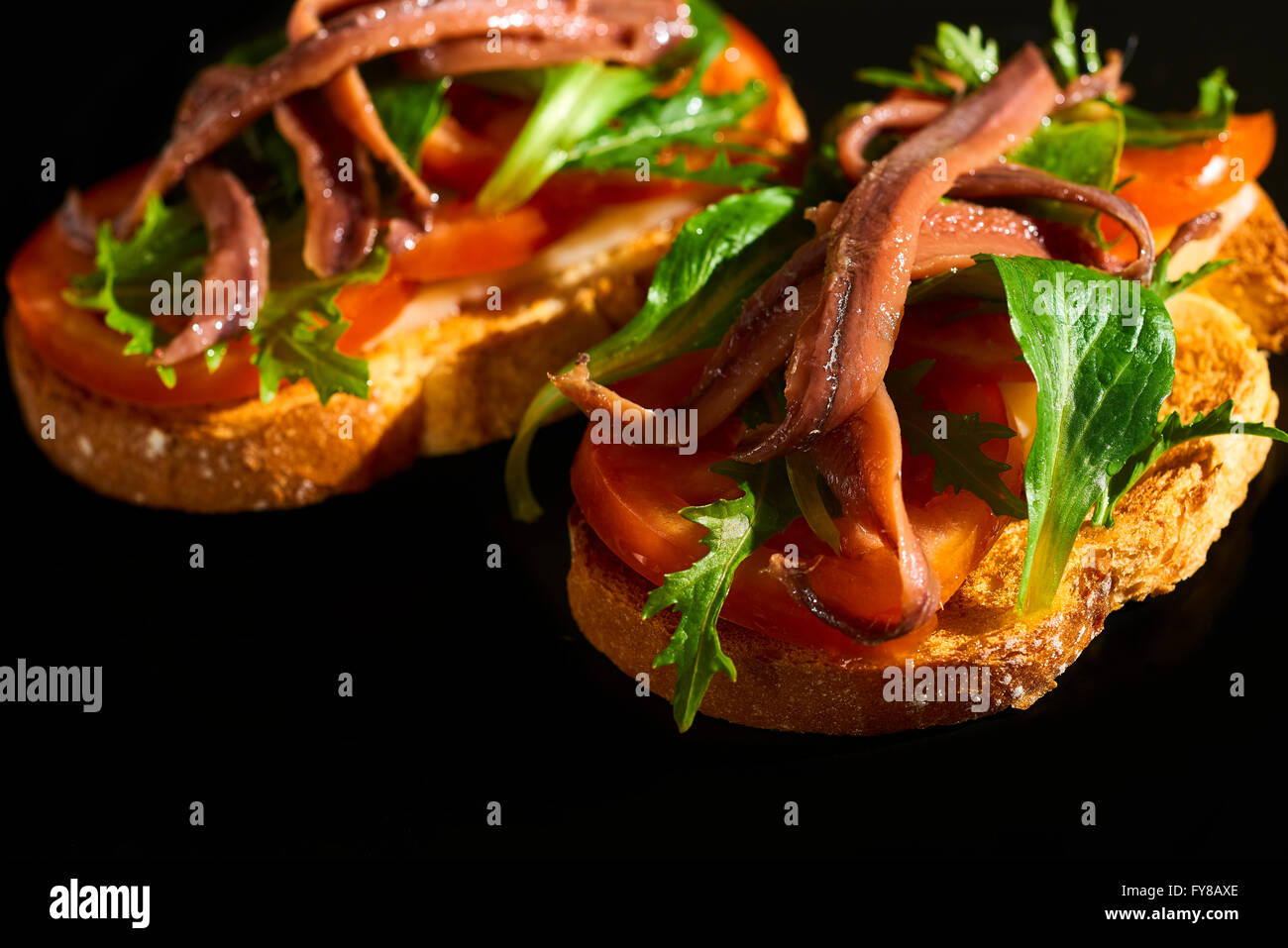 Spanish Tapa, Toast with Rocket (Arugula), Tomato, Lamb's Lettuce and