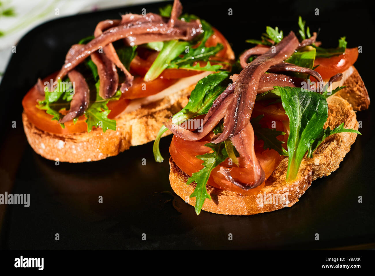 Spanish Tapa, Toast with Rocket (Arugula), Tomato, Lamb's Lettuce and