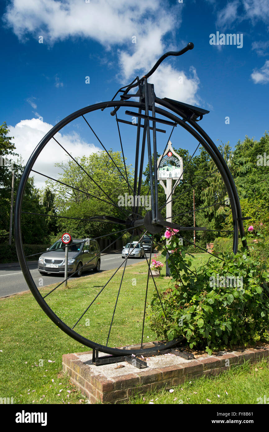 UK, Kent, Sissinghurst, Giant penny farthing metal sculpture and village sign Stock Photo