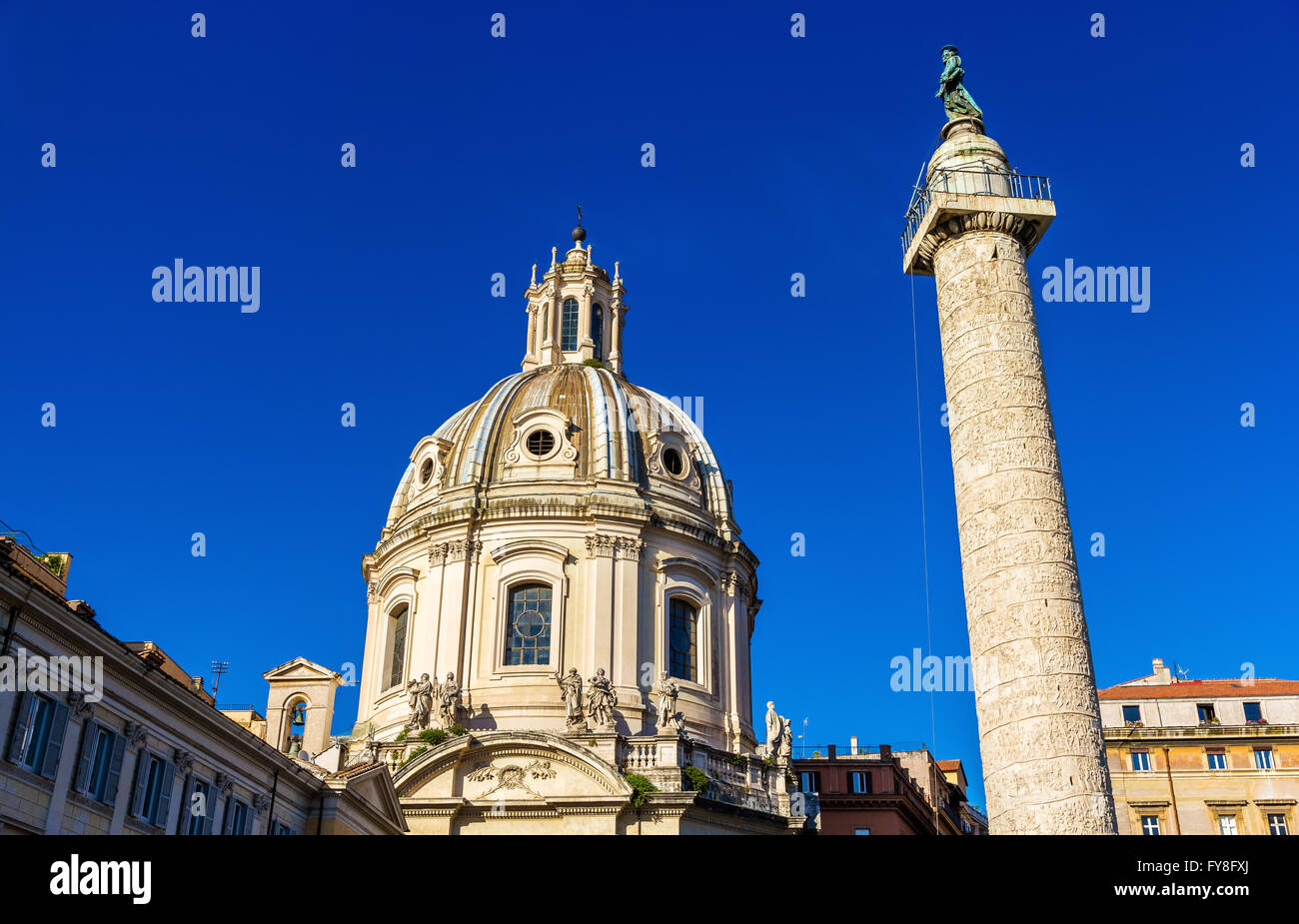 Trajan's Column and Santissimo Nome di Maria al Foro Traiano Church in Rome Stock Photo