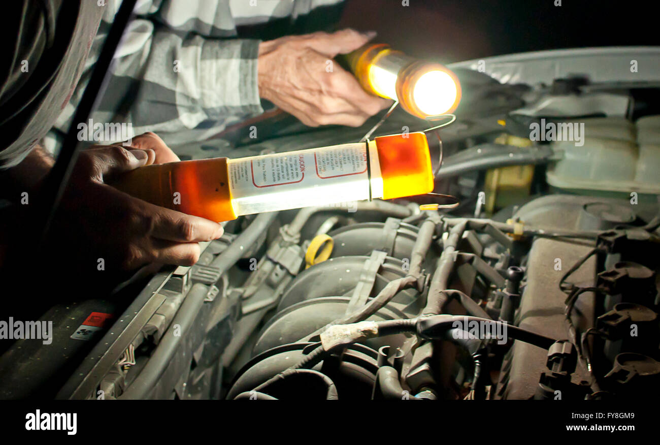 Car repair at night with flashlights Stock Photo Alamy