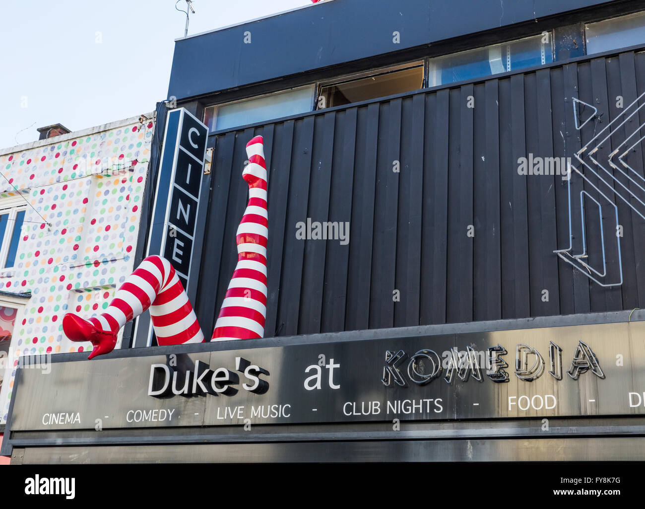 Front of Dukes at Komedia Cinema and Night Club in Brighton Sussex with its display of two legs in red and white long socks Stock Photo