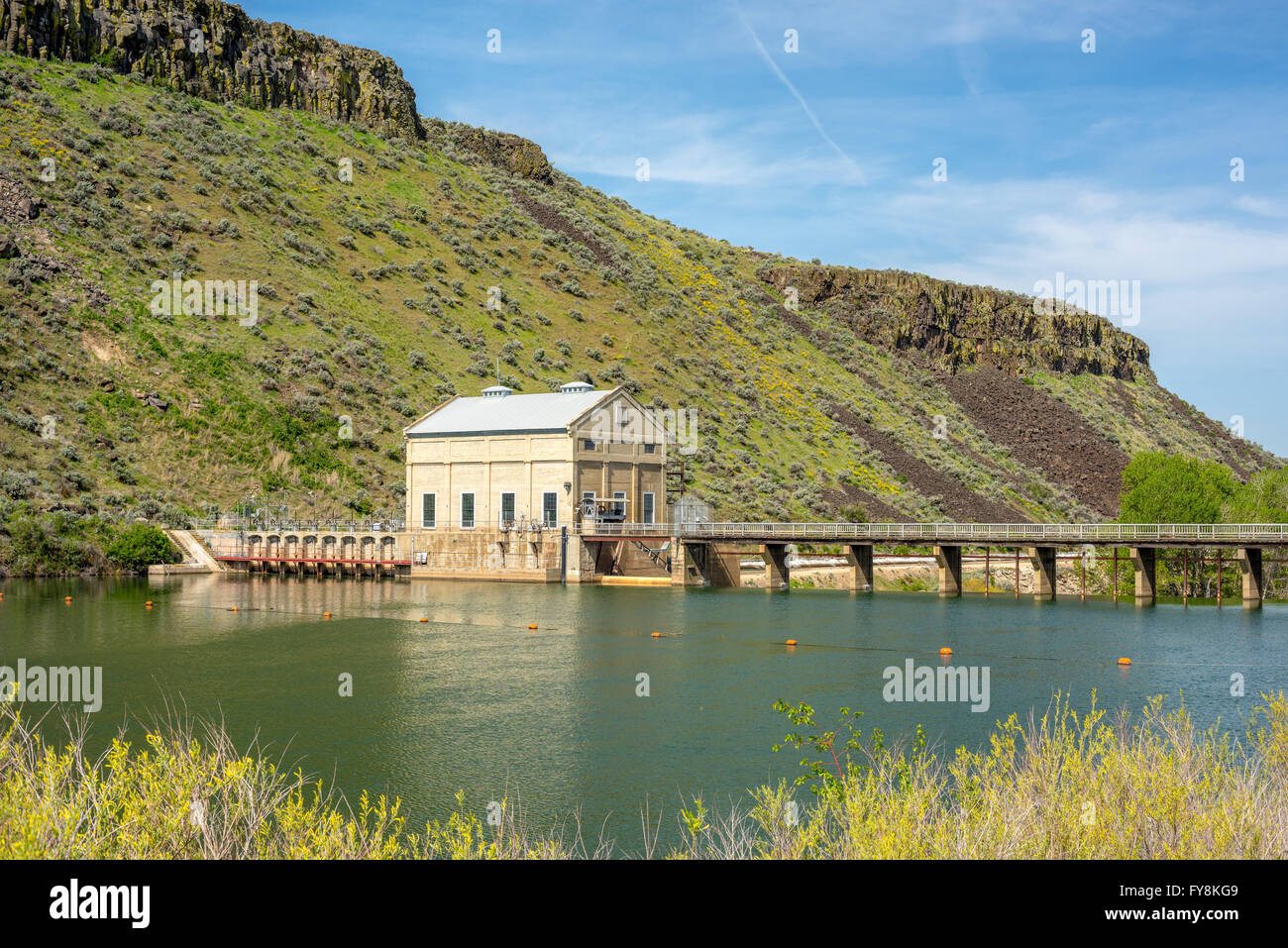 High water behind a Diversion Dam on the Boise River Idaho Stock Photo