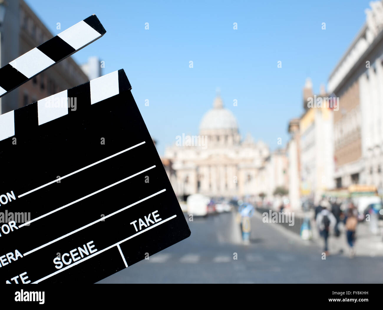 Movie clapper board with St Peter cathedral view out of focus in background Stock Photo