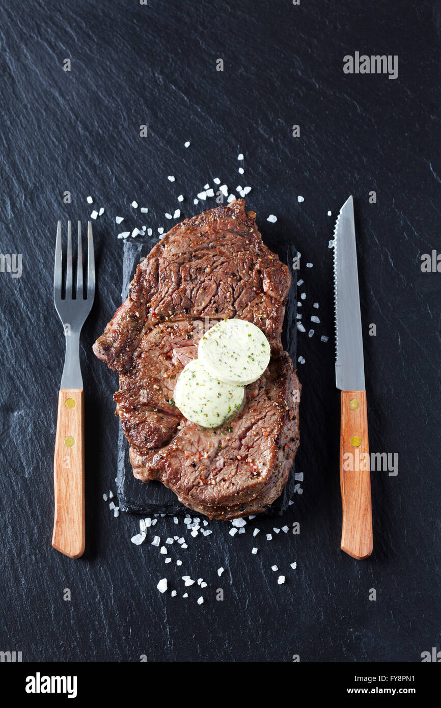 Rib eye steak with herbed butter and salt Stock Photo Alamy