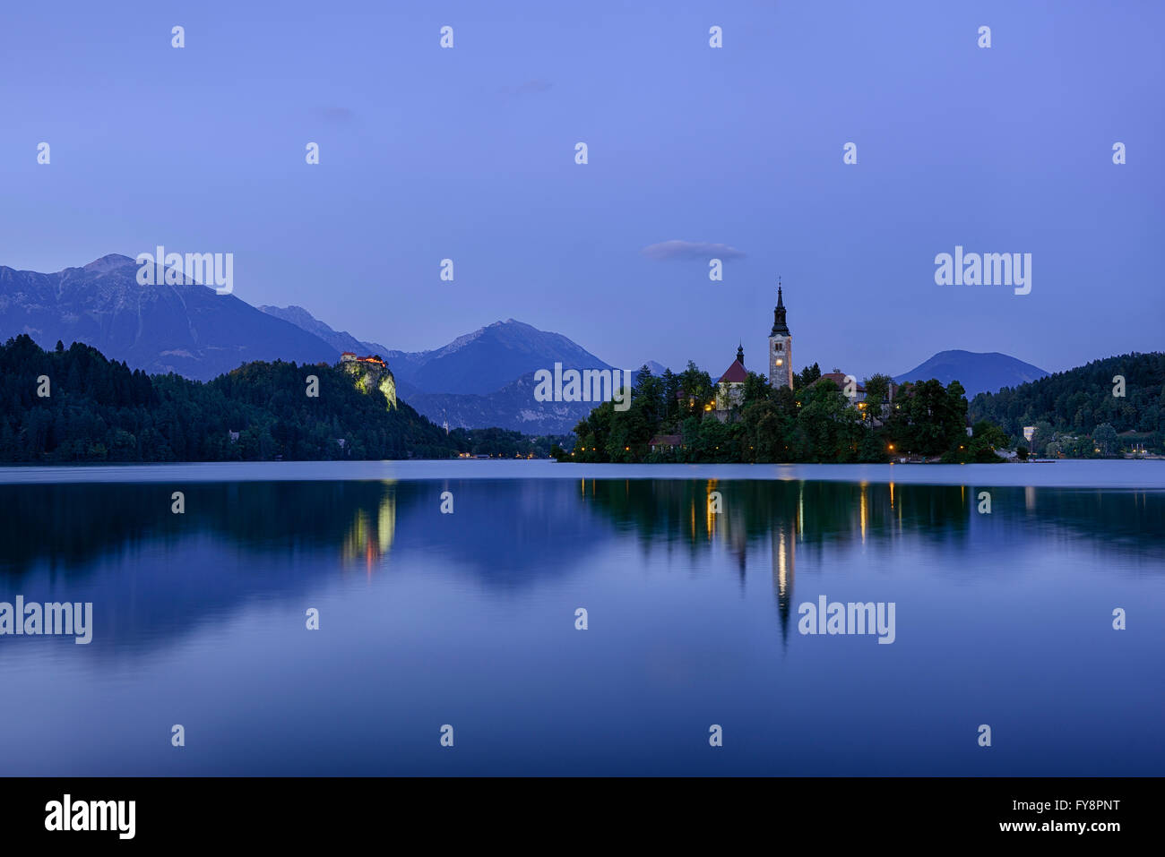 Slovenia, Gorenjska, Bled, Bled Island, Assumption of Mary's Pilgrimage Church and Lake Bled in the evening Stock Photo