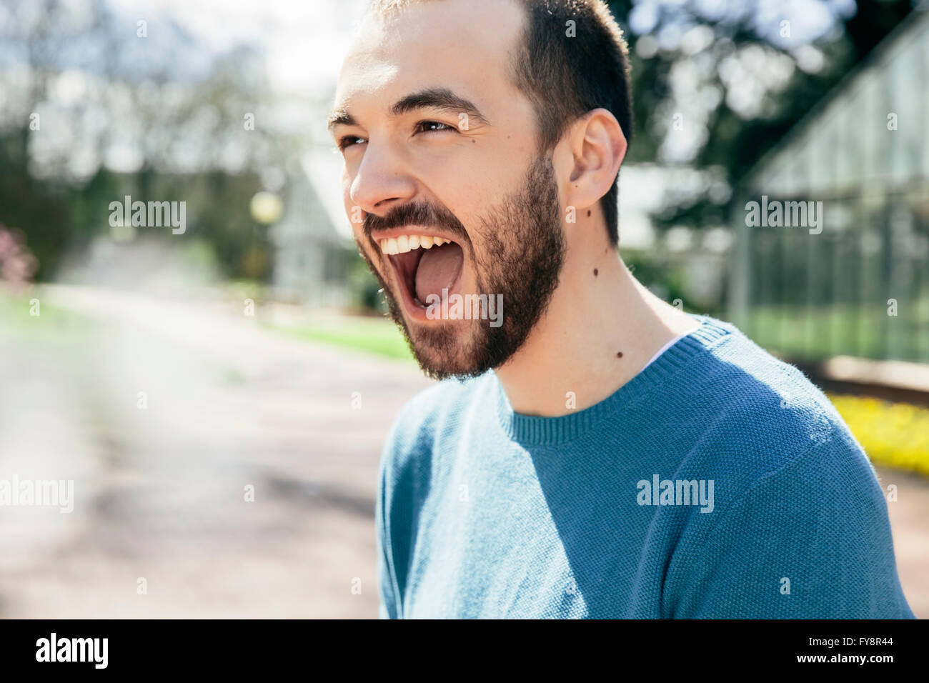 Portrait of young man crying for joy Stock Photo