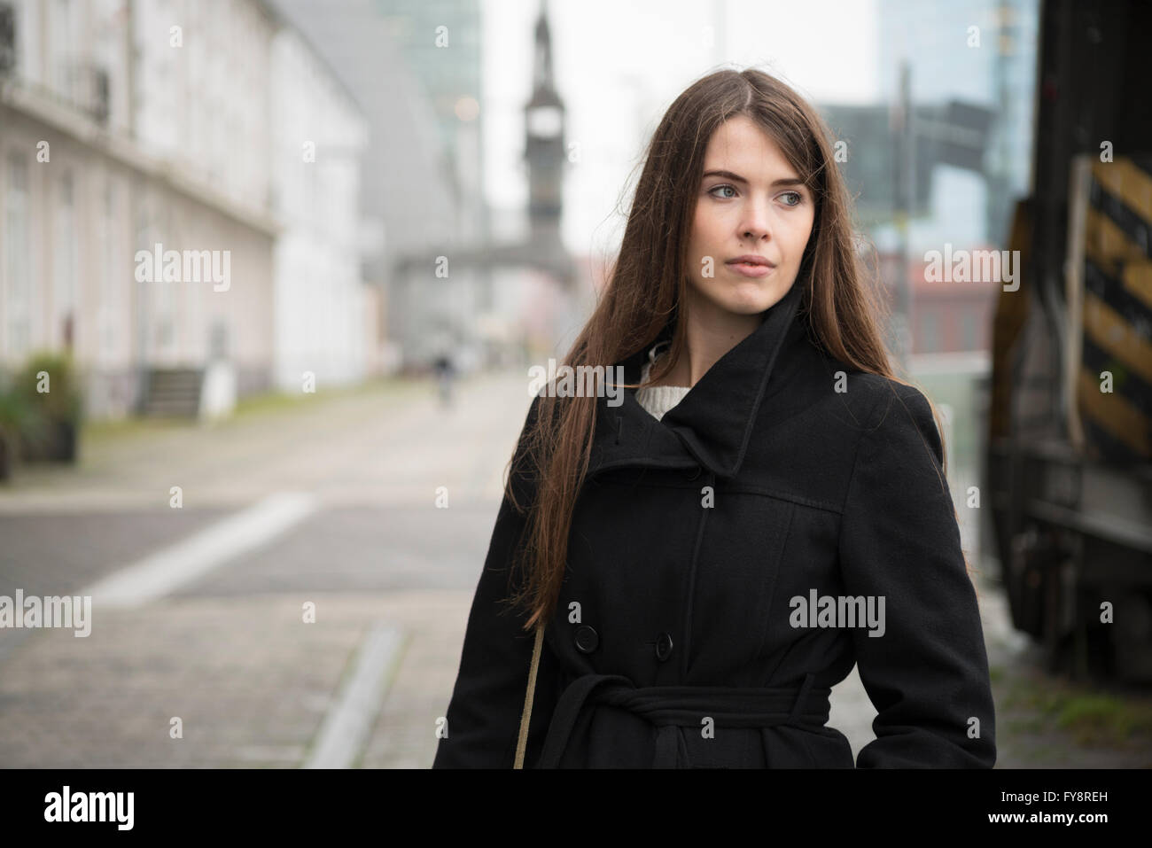 Woman black coat in hi-res stock photography and images - Alamy
