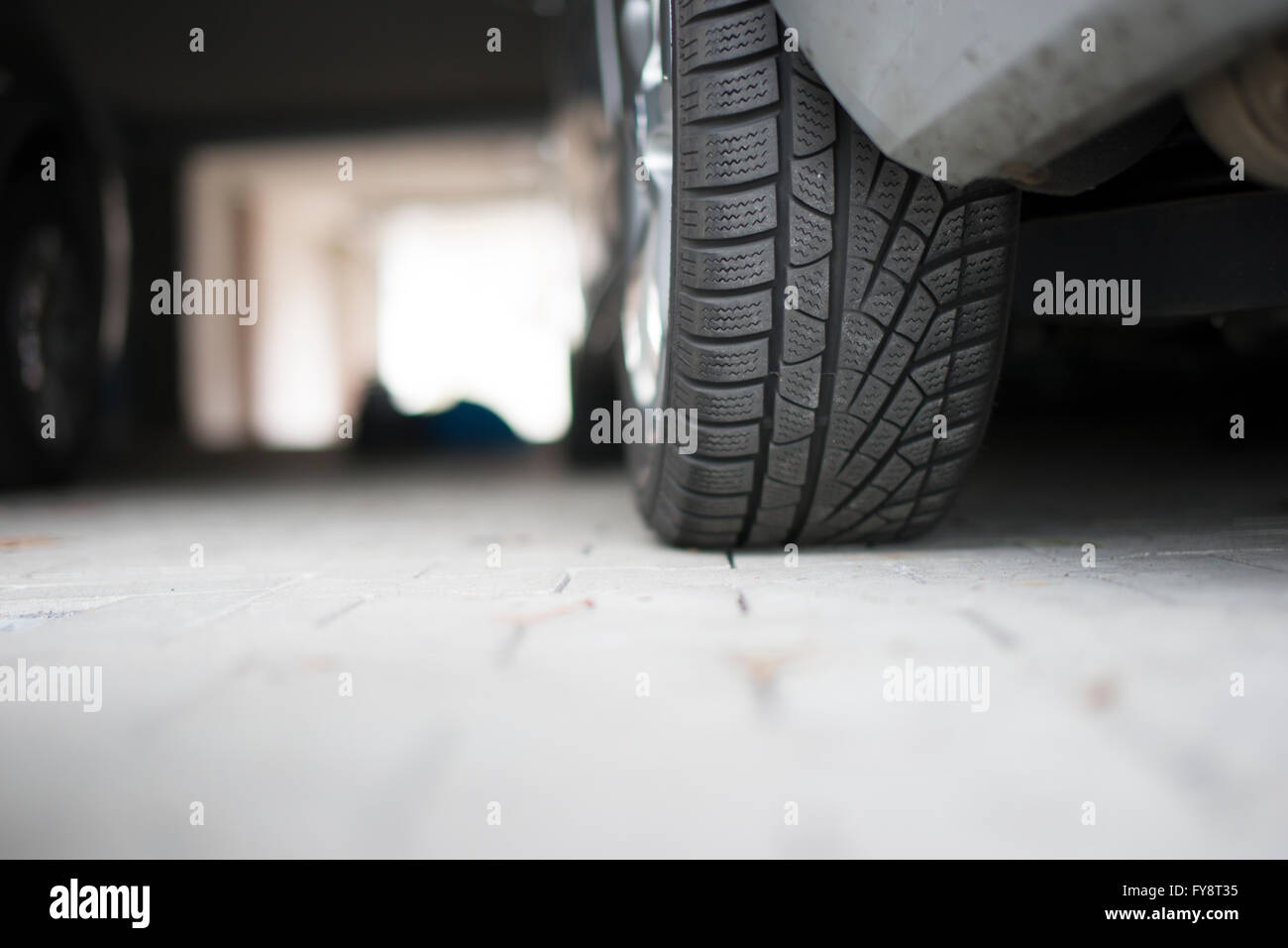 Germany, Car at underground car park, detail of tire Stock Photo - Alamy
