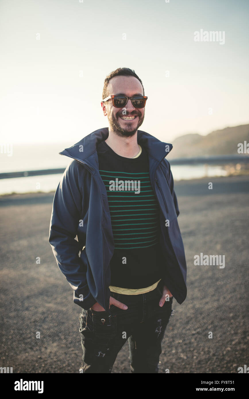 Portrait of smiling man with sunglasses Stock Photo - Alamy