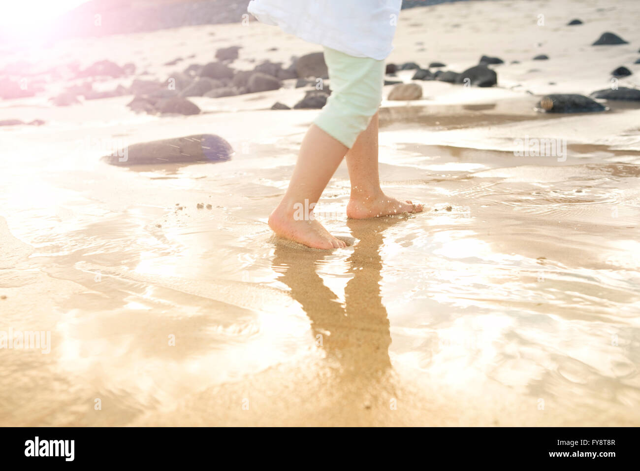 girl-walking-in-shallow-water-stock-photo-alamy