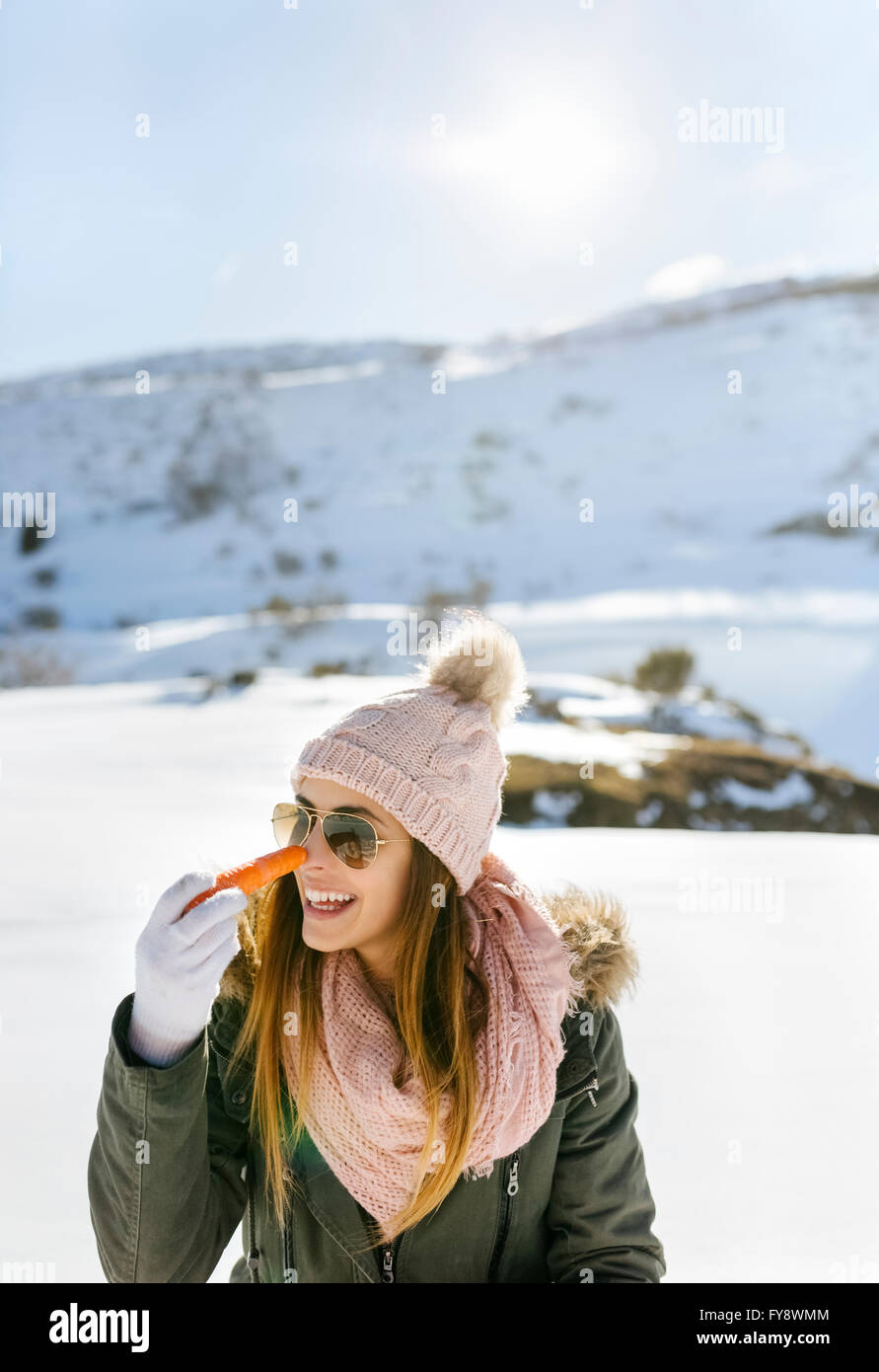 Happy young woman carrot in snowy hi-res stock photography and images ...