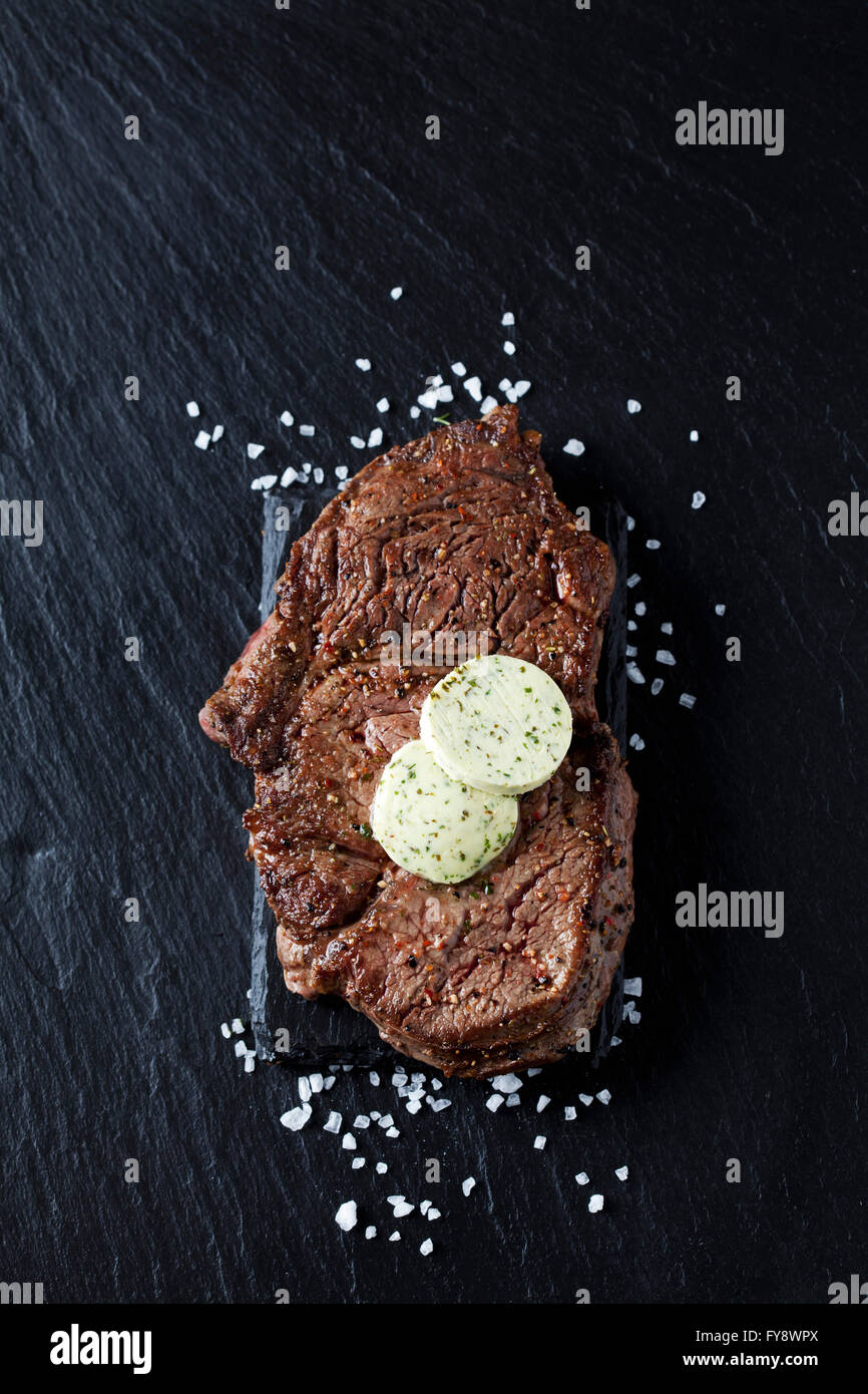 Rib eye steak with herbed butter and salt Stock Photo Alamy