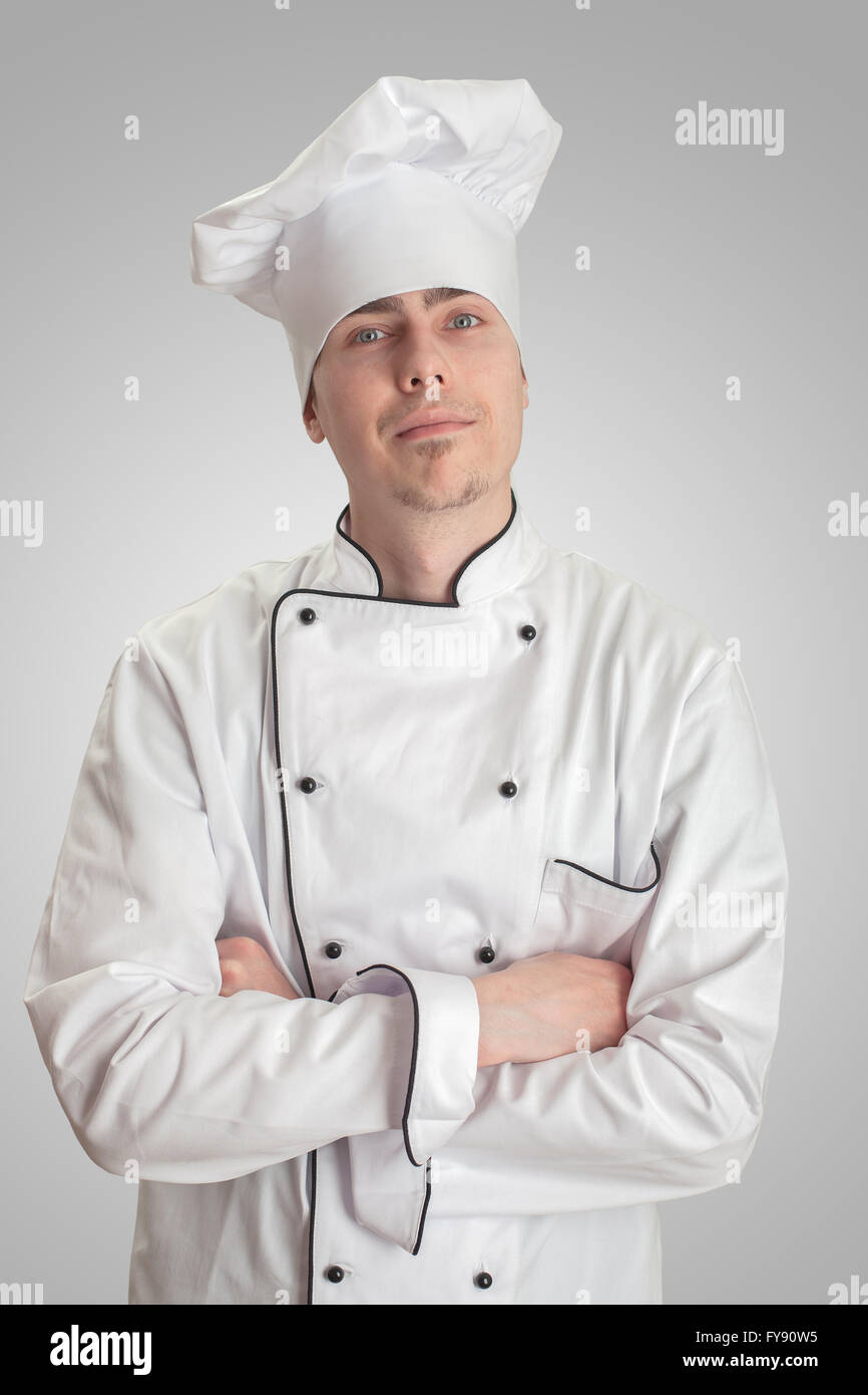 young cook man standing on a white background Stock Photo Alamy