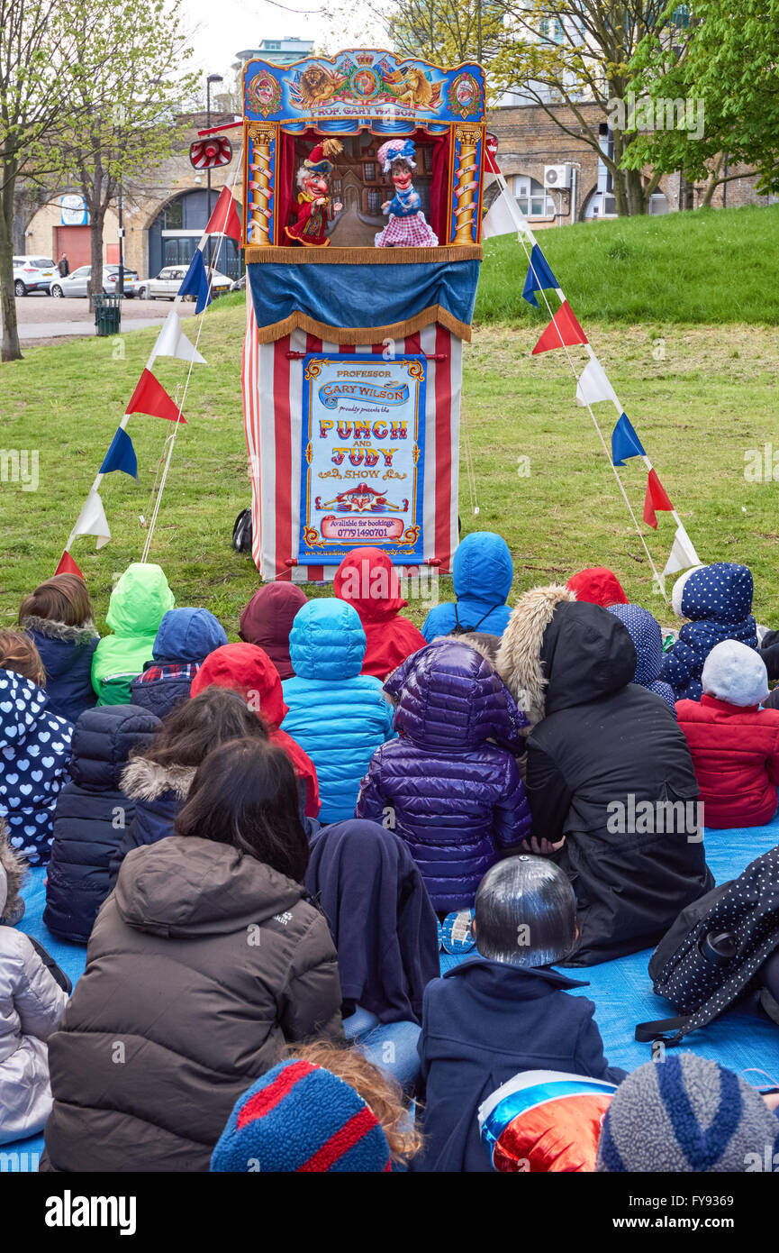 Children and their parents watching traditional Punch and Judy hand puppets show, London England United Kingdom UK Stock Photo