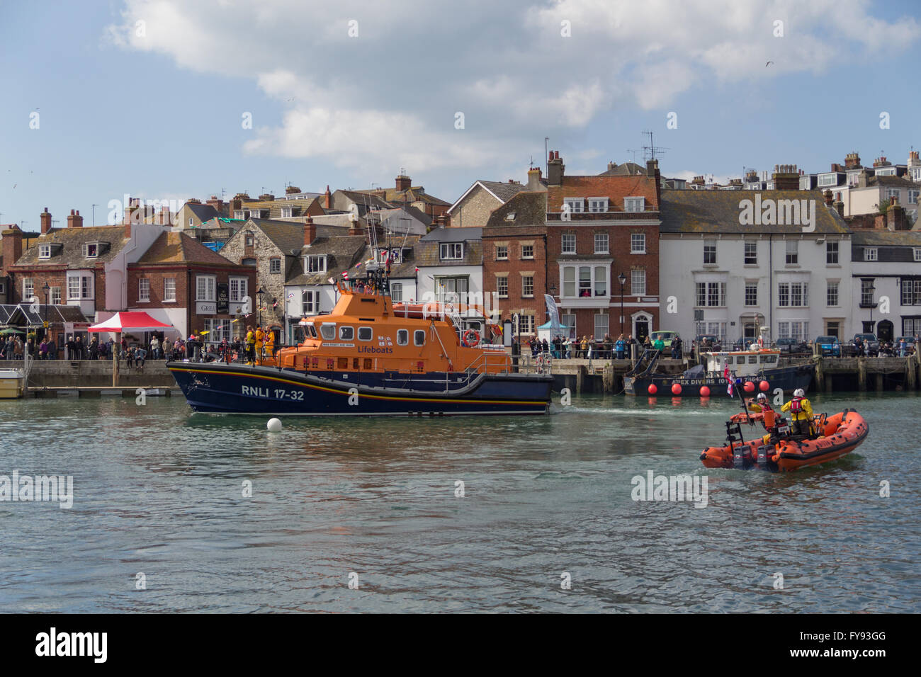 Weymouth, England. 23 April 2016. Queen's 90th Birthday Floating Tribute. RNLI Lifeboat & Dingh. Credit:  Frances Underwood/Alamy Live News Stock Photo