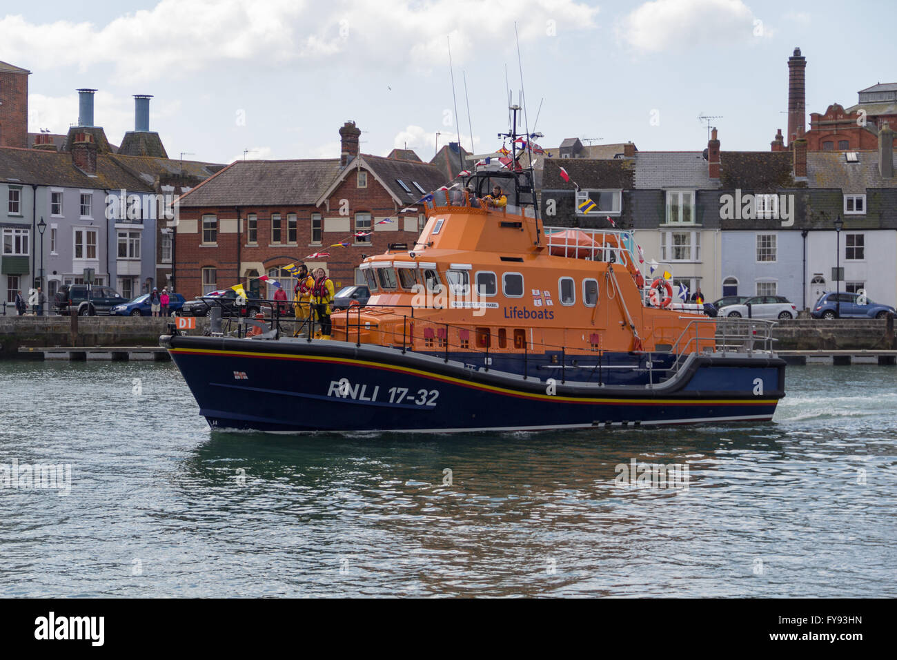 Weymouth, England. 23 April 2016. Queen's 90th Birthday Floating Tribute. RNLI Lifeboat Returning. Credit:  Frances Underwood/Alamy Live News Stock Photo