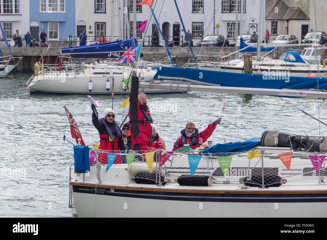 Weymouth, England. 23 April 2016. Queen's 90th Birthday Floating Tribute. Westerly Merlin, people waving. Credit:  Frances Underwood/Alamy Live News Stock Photo