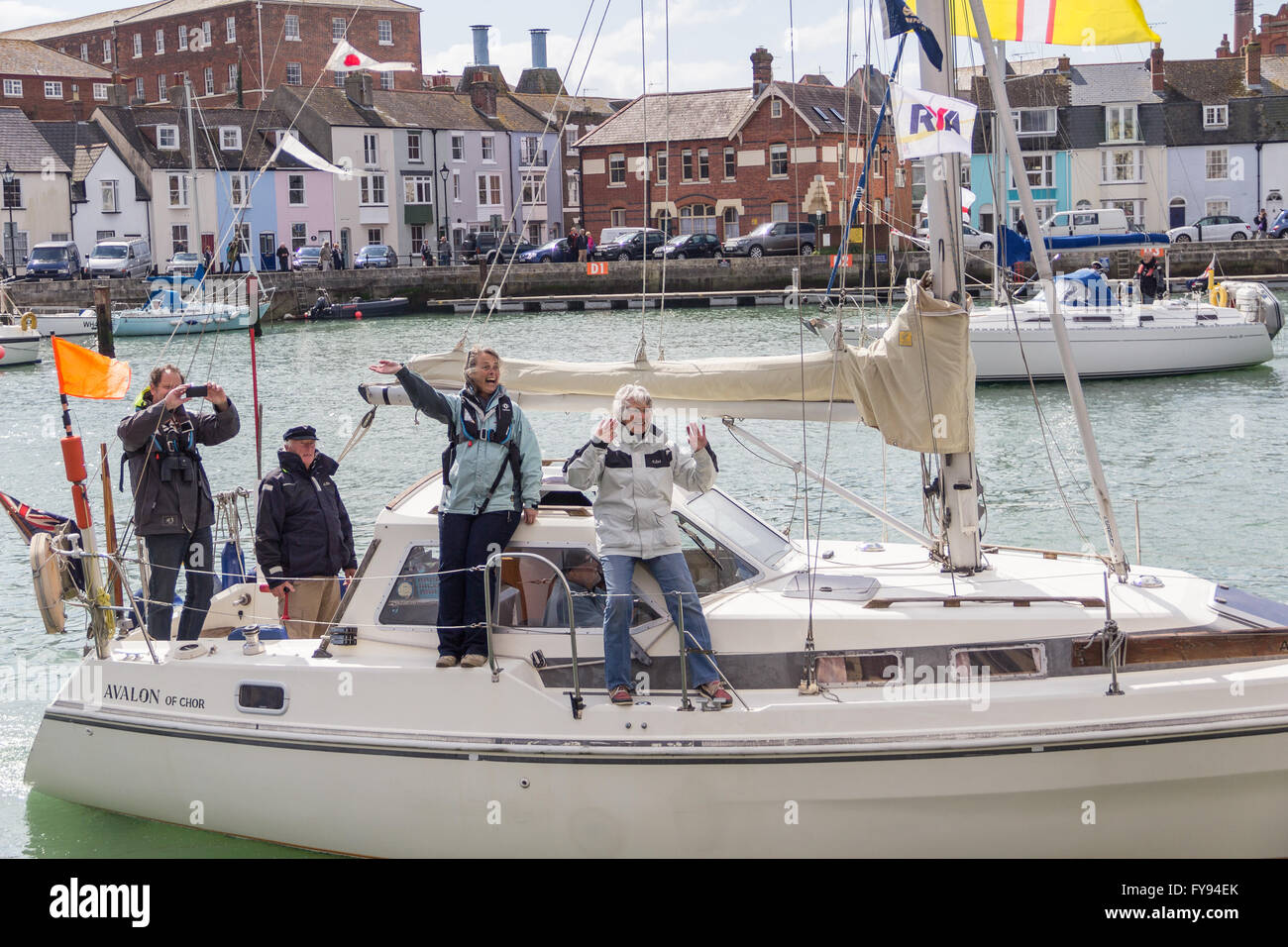Weymouth, England. 23 April 2016. Queen's 90th Birthday Floating Tribute. Avalon, people waving. Credit:  Frances Underwood/Alamy Live News Stock Photo