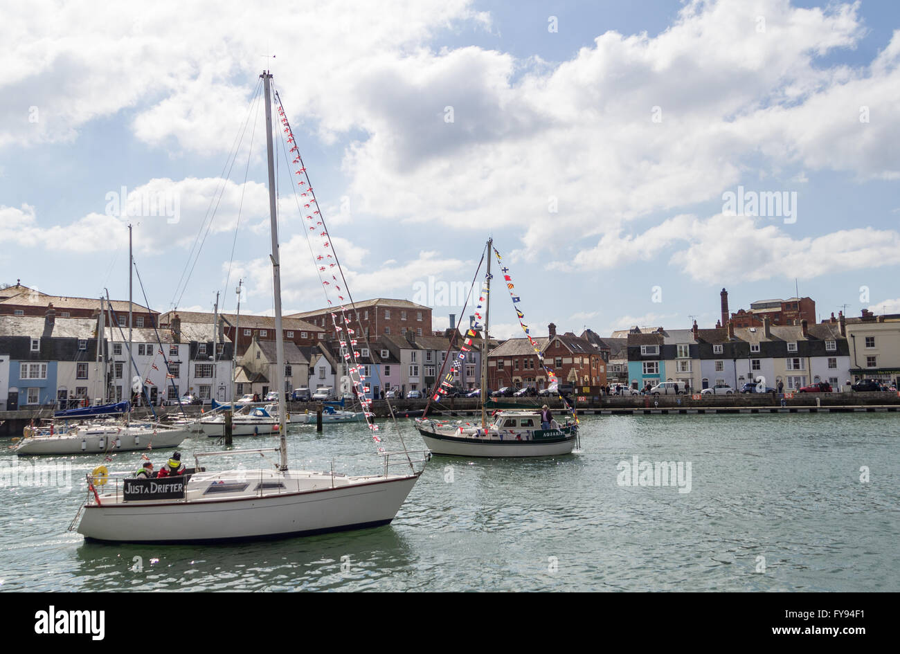 Weymouth, England. 23 April 2016. Queen's 90th Birthday Floating Tribute. Just a Drifter and another boat, decked with flags. Credit:  Frances Underwood/Alamy Live News Stock Photo