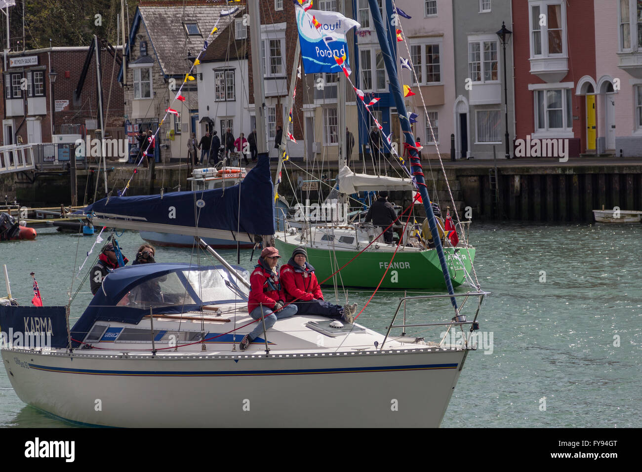 Weymouth, England. 23 April 2016. Queen's 90th Birthday Floating Tribute. Karma, two people sitting on front. Credit:  Frances Underwood/Alamy Live News Stock Photo