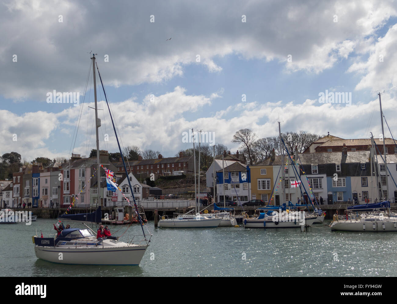 Weymouth, England. 23 April 2016. Queen's 90th Birthday Floating Tribute. Karma, two people sitting on front, distan. Credit:  Frances Underwood/Alamy Live News Stock Photo