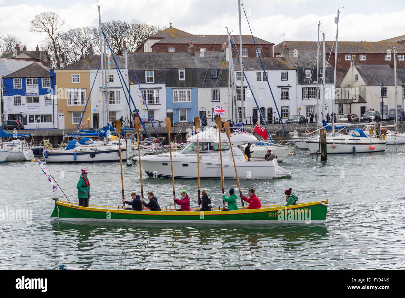 Weymouth, England. 23 April 2016. Queen's 90th Birthday Floating Tribute. Sir Tristan, rowers saluting. Credit:  Frances Underwood/Alamy Live News Stock Photo
