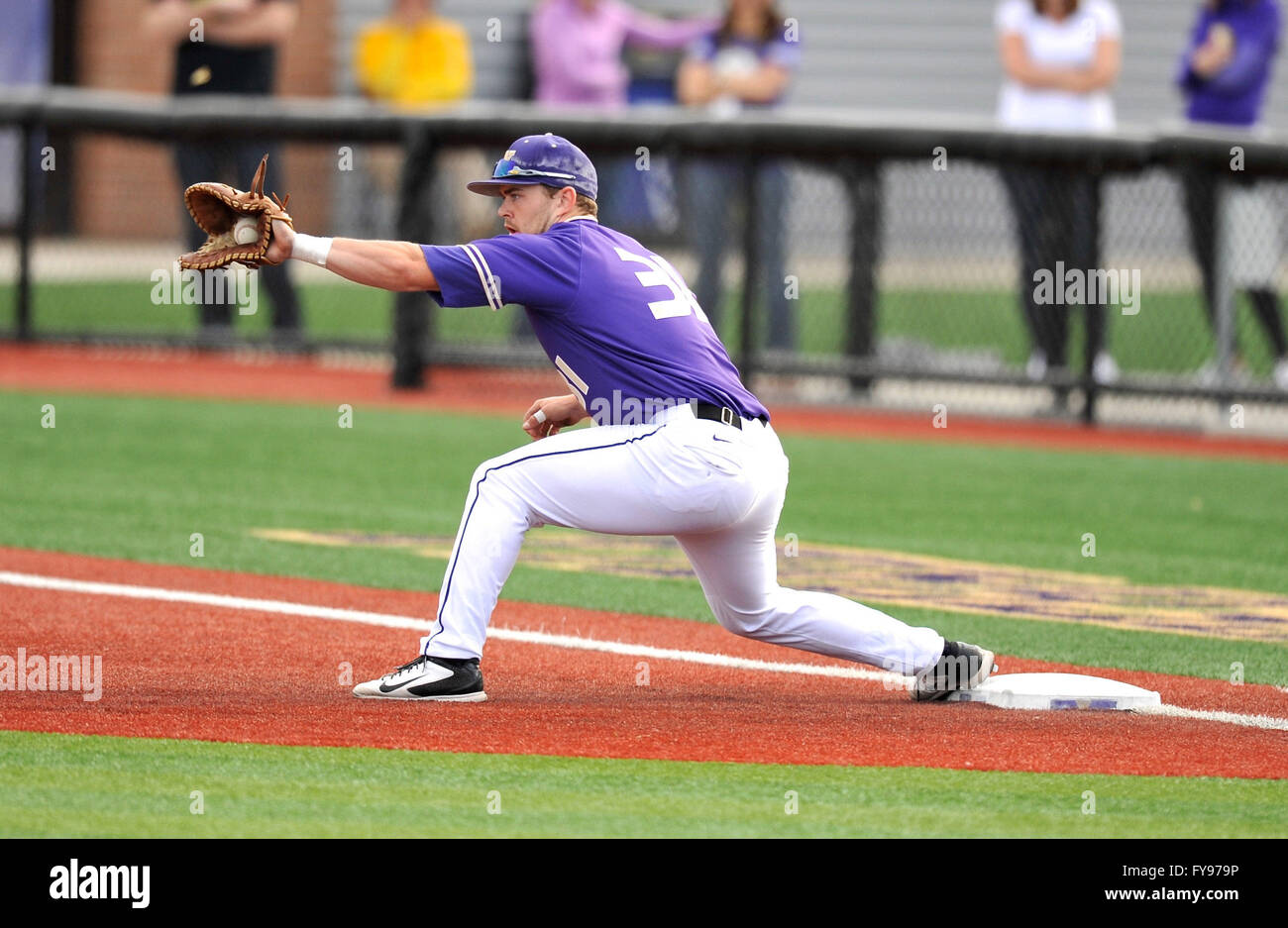 UW firstbaseman John Naff (31) makes the play at 1st base for an out during  this non-conference NCAA baseball game between St Marys and the University  of Washington. The University of Washington